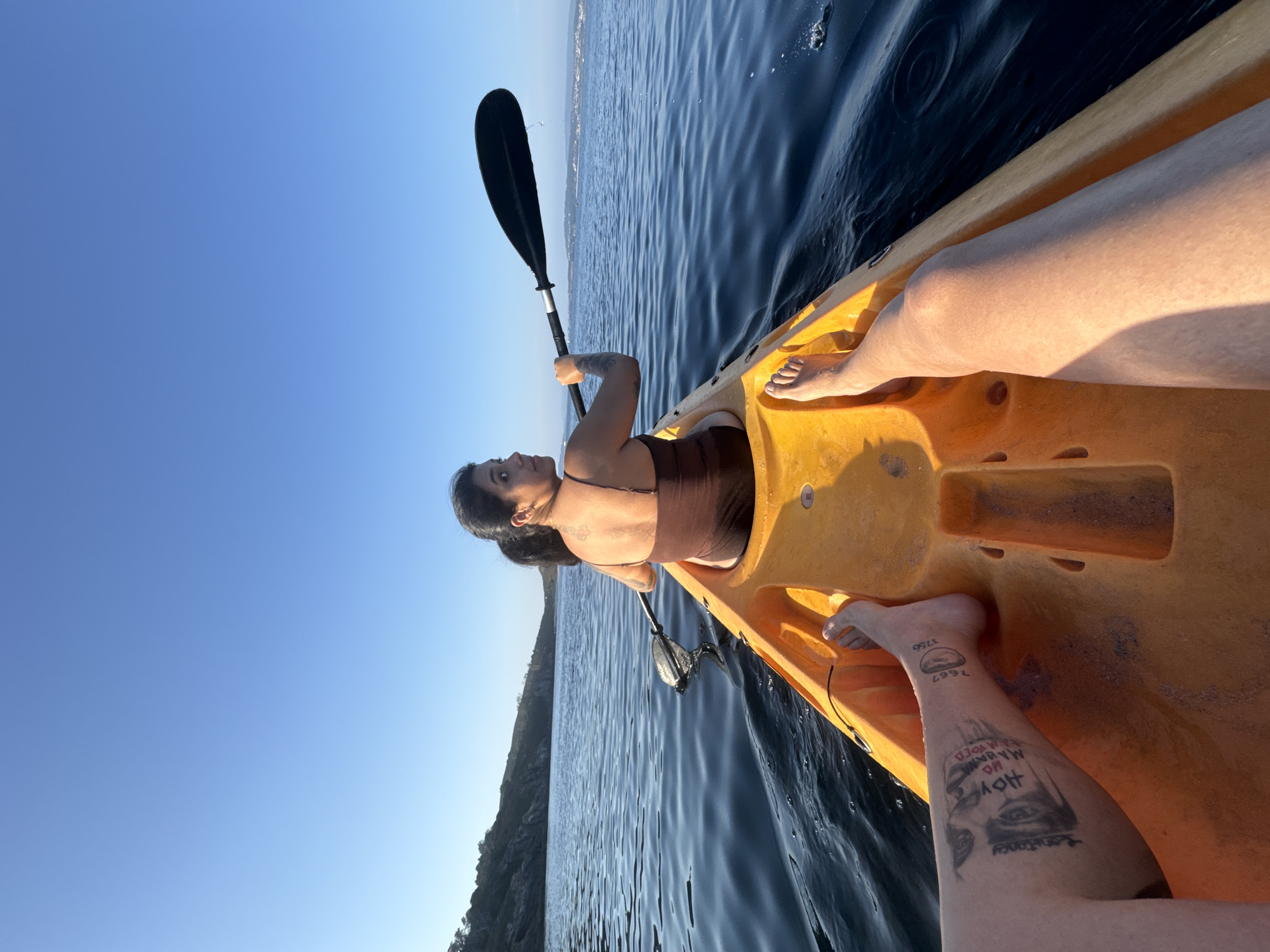 Kayaking the coast off Ons Island, Spain