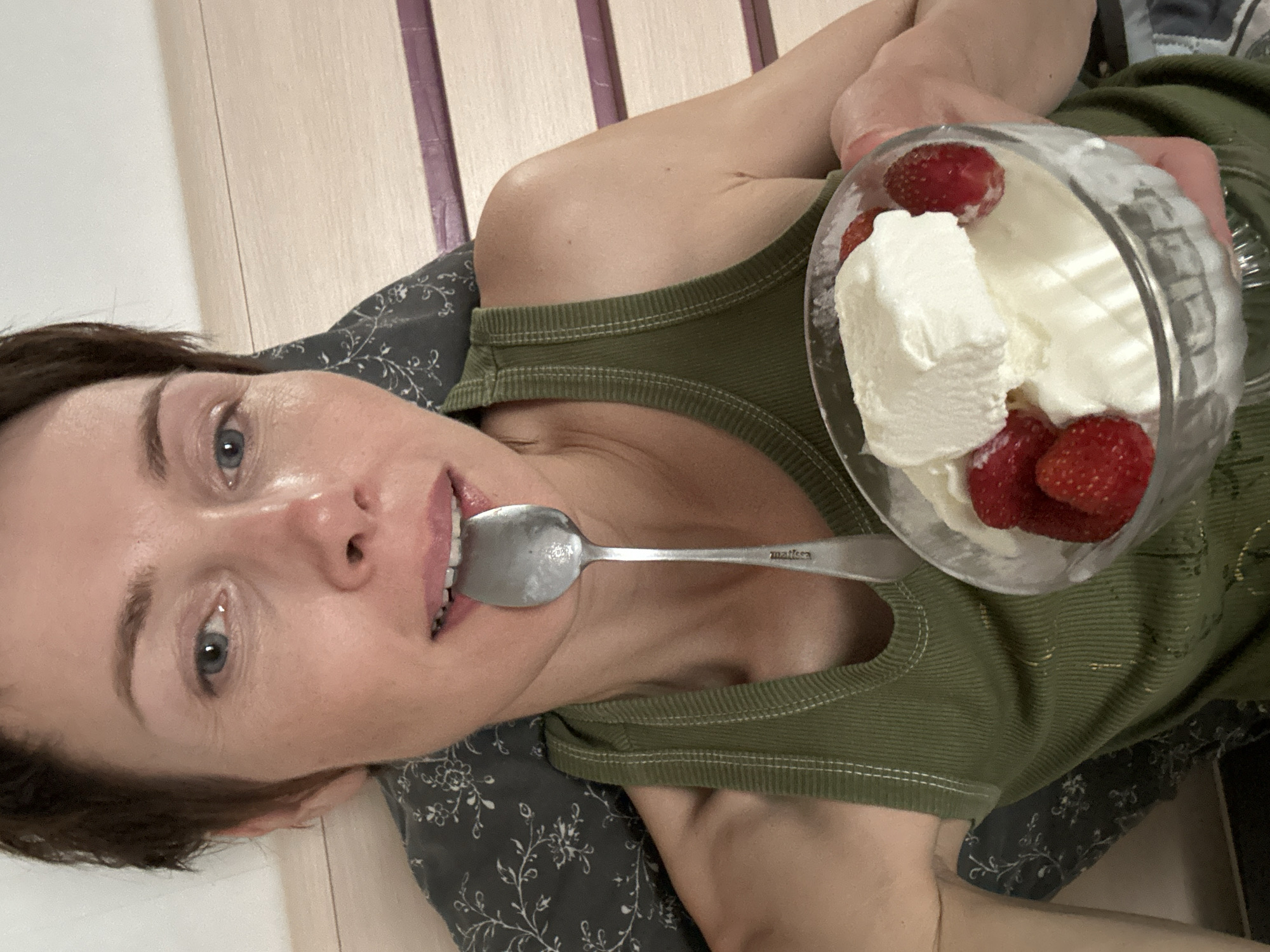 Snacking on ice cream and strawberries in bed, Kemerovo