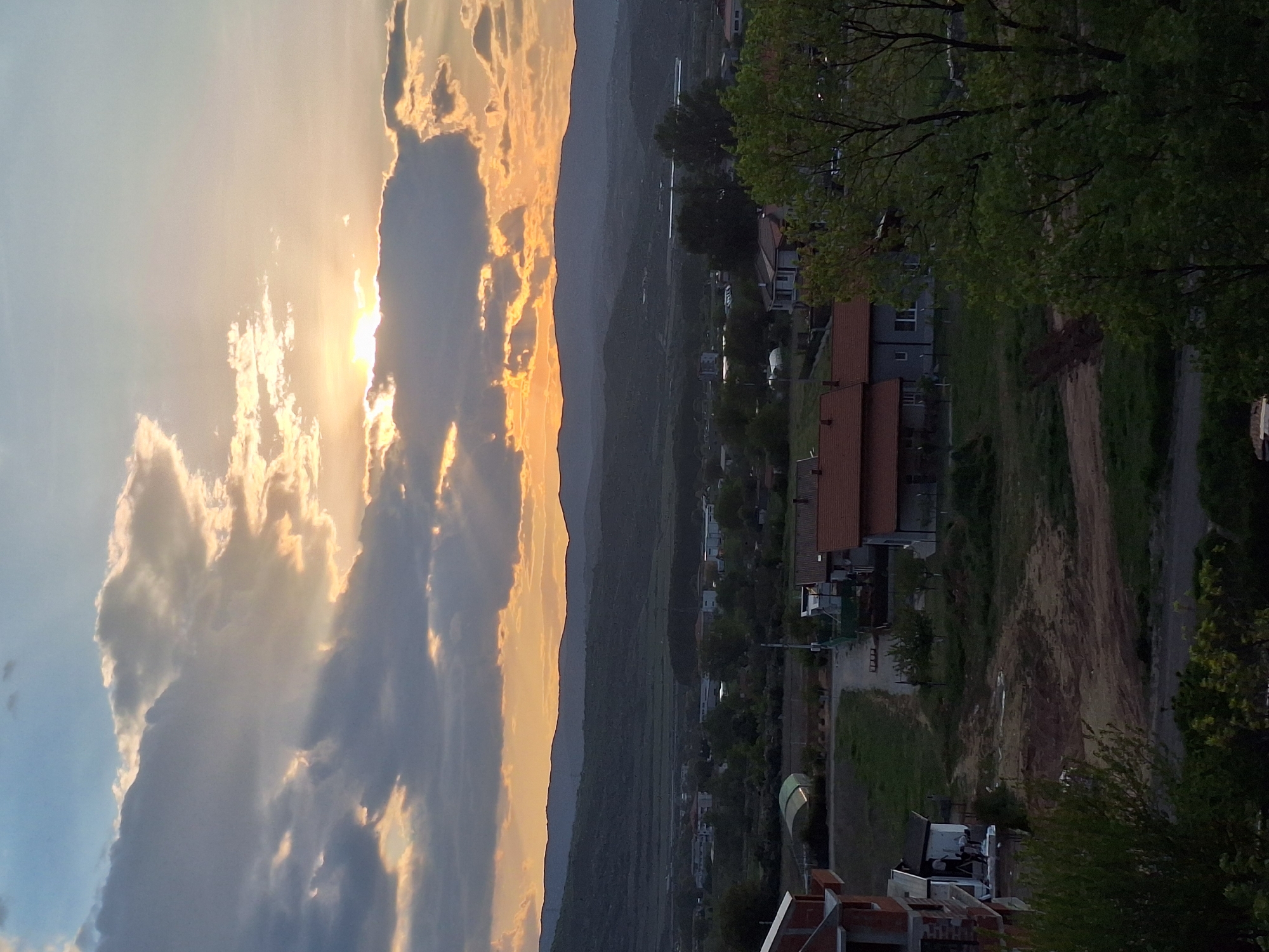 Dramatic sunset illuminates cloudy sky over Blagoevgrad valley