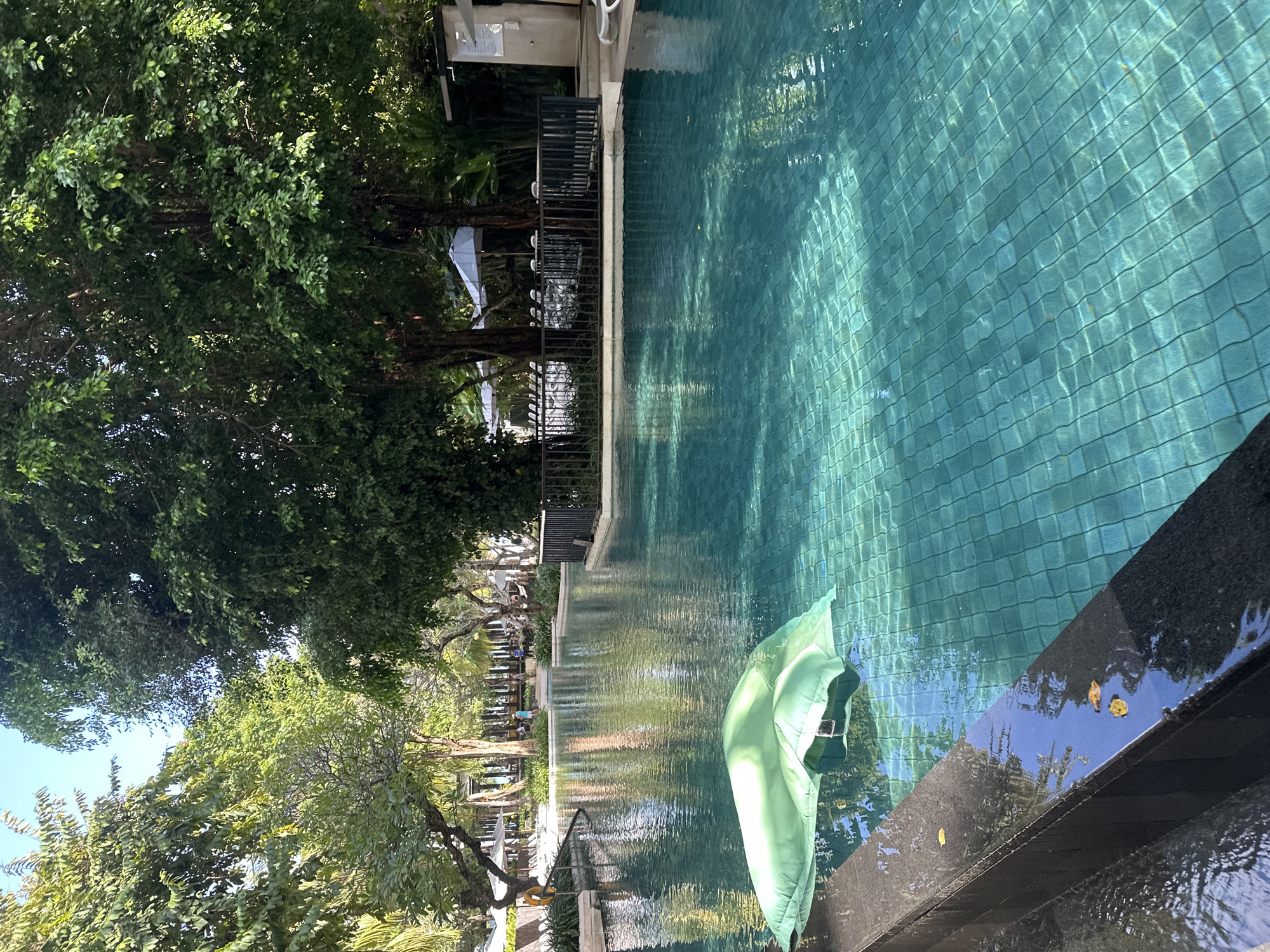 Lazy resort morning in Kuta — pool, buffet, and beach views