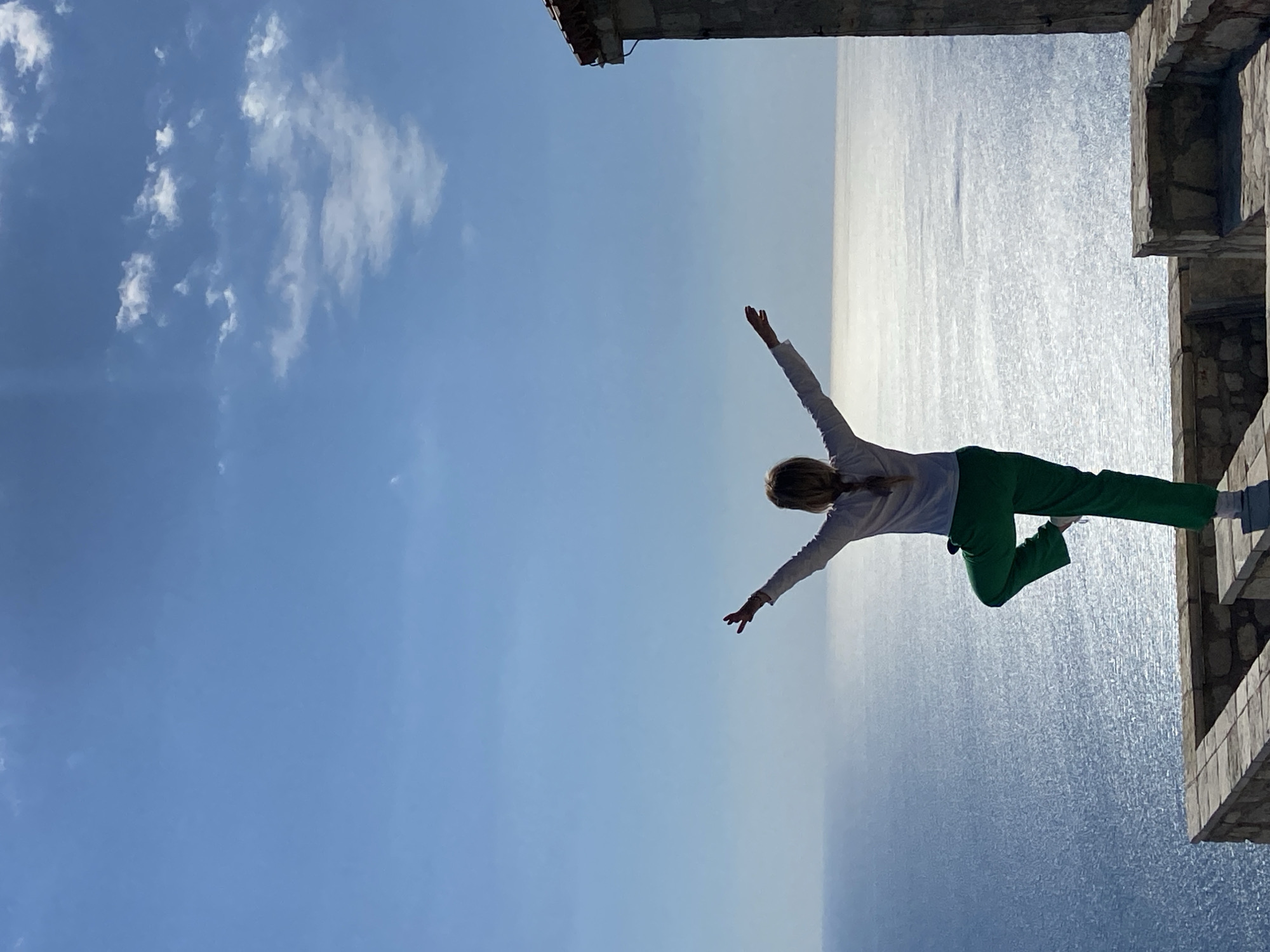 Person poses for photo at Kamenovo coastline, Montenegro