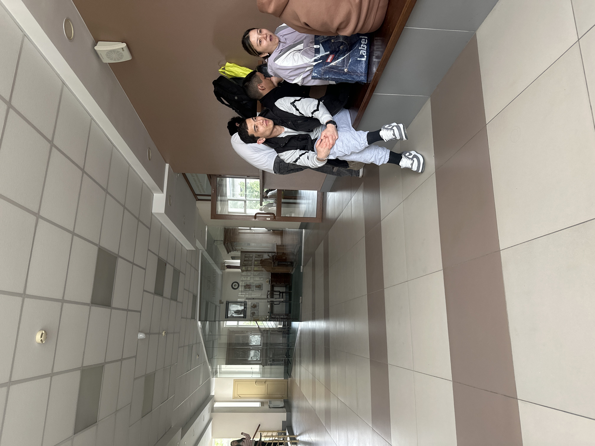 Young people rest in Kazan institutional hallway