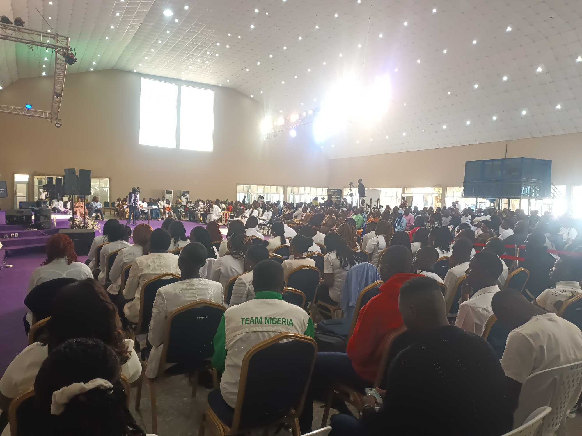 Live performance event at a large hall in Gura Top, Nigeria