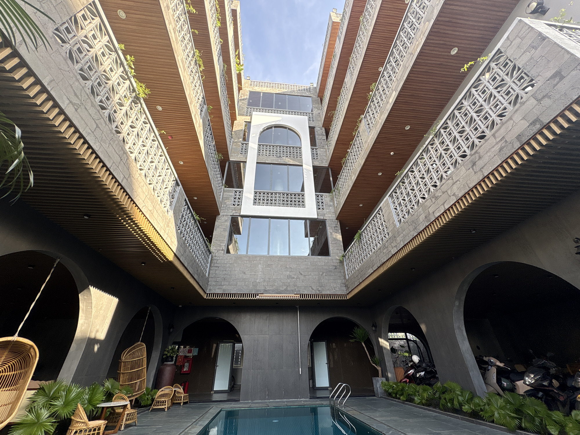 Digital nomad works poolside at Da Nang complex
