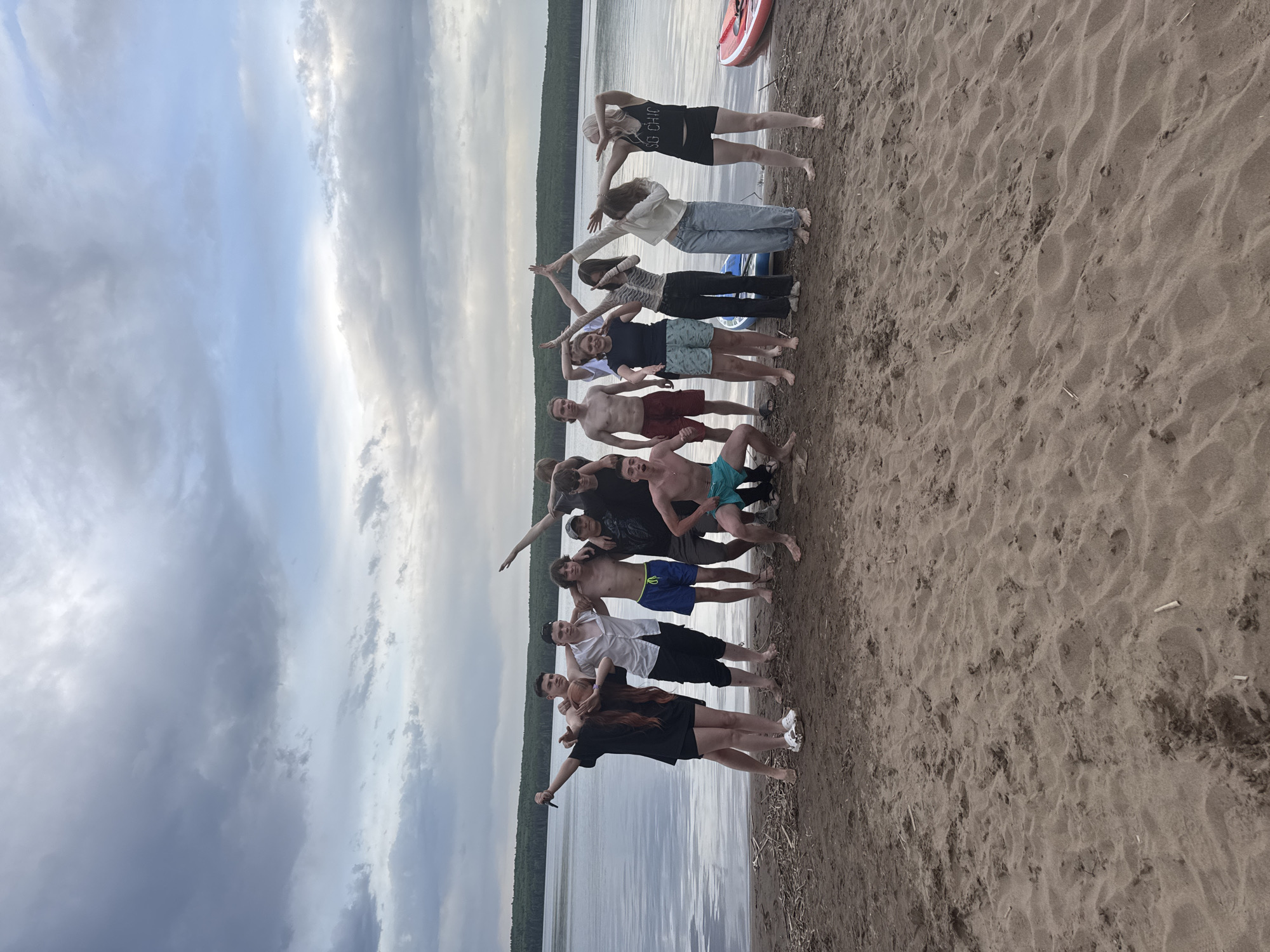 Beach gathering features human formations and wrestling in Chaikovsky