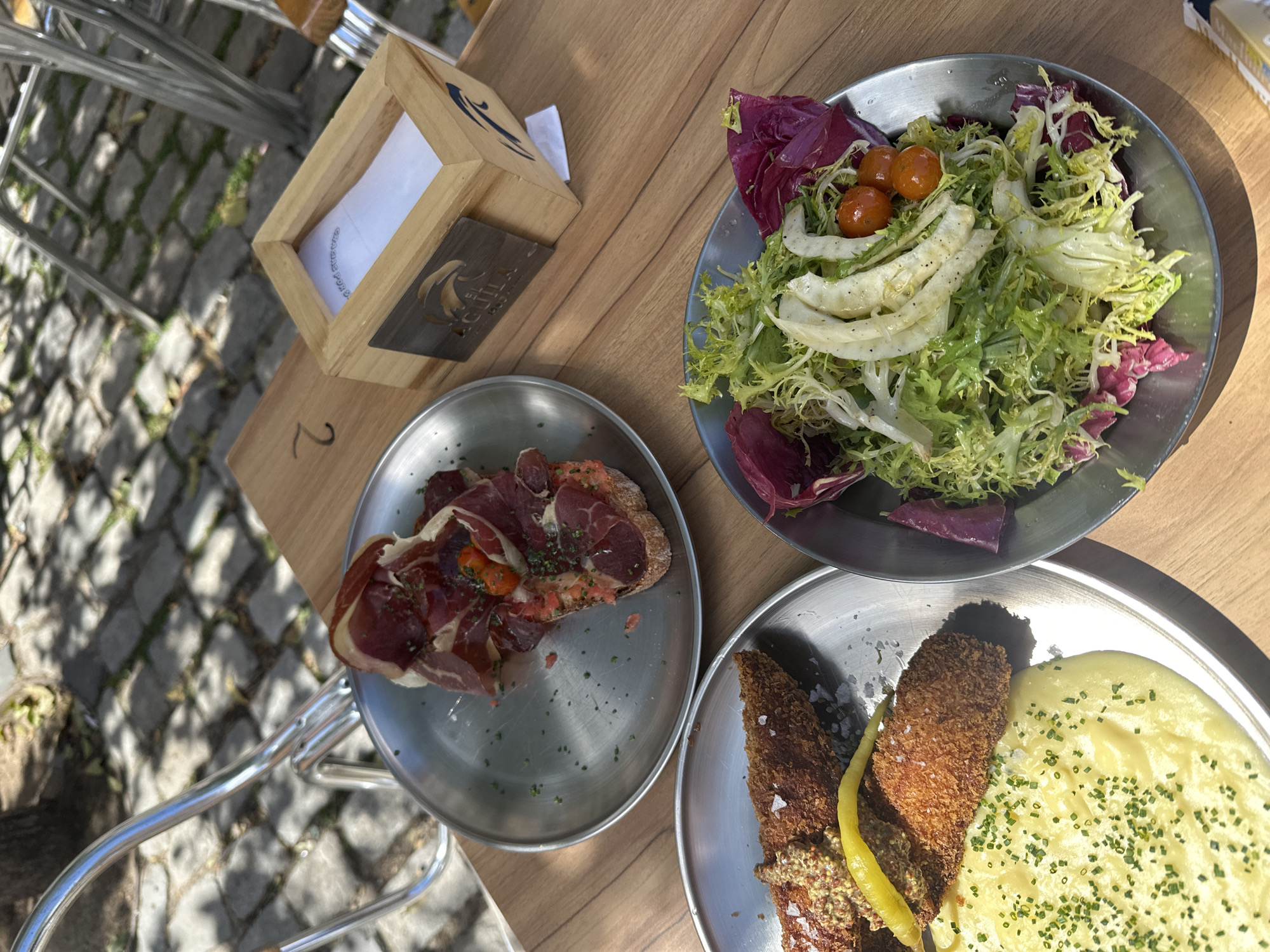 Lunch documented at Madrid restaurant with mixed salads, bread