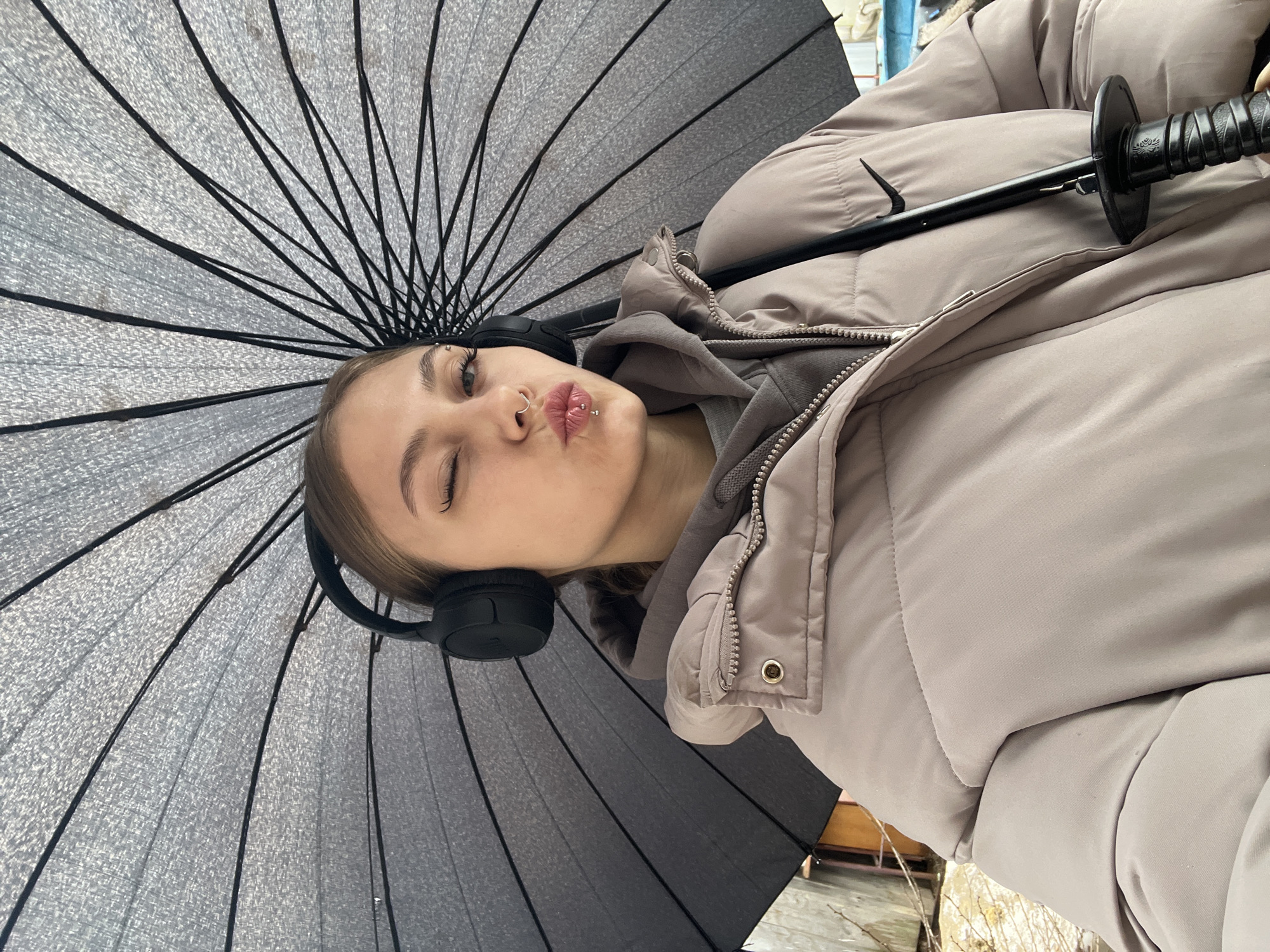 Woman poses playfully with umbrella in early morning Russia