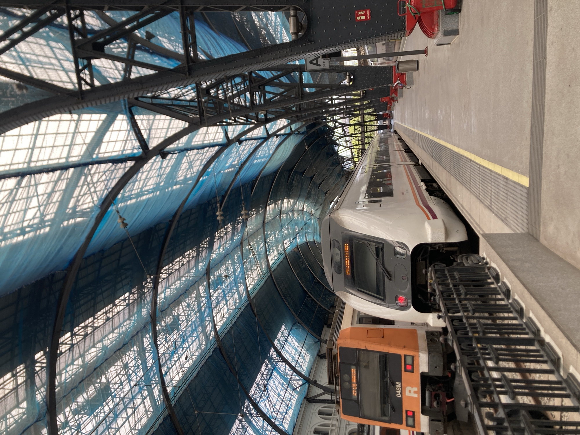 Barcelona train station tour captures platforms, architecture, street art