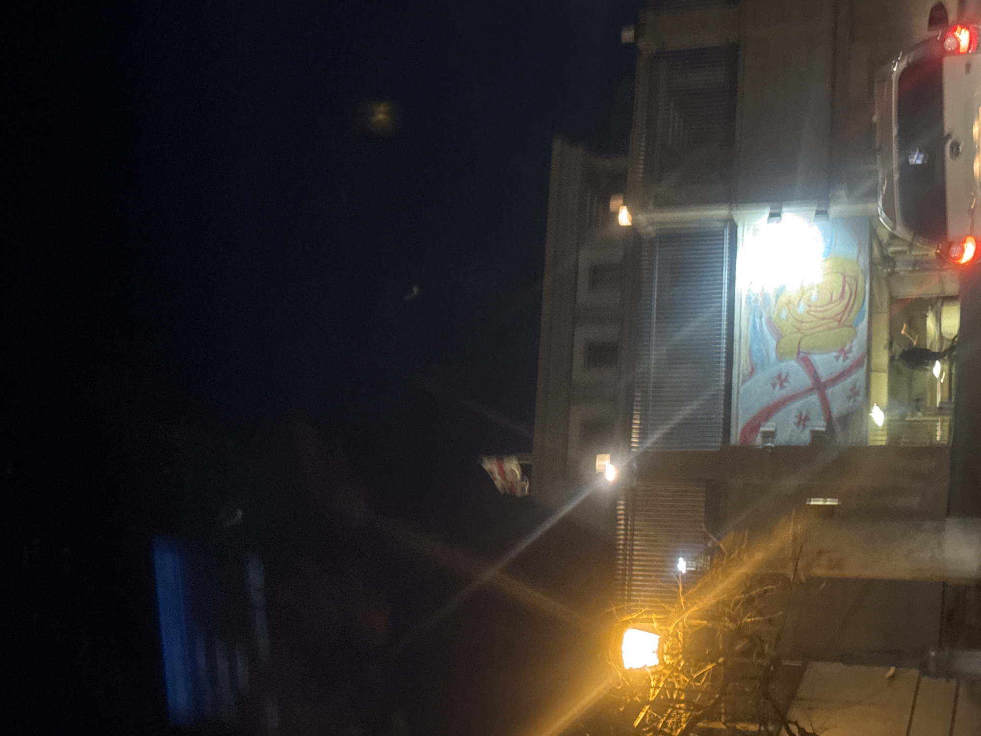 Illuminated religious and decorative displays spotted on Tbilisi buildings
