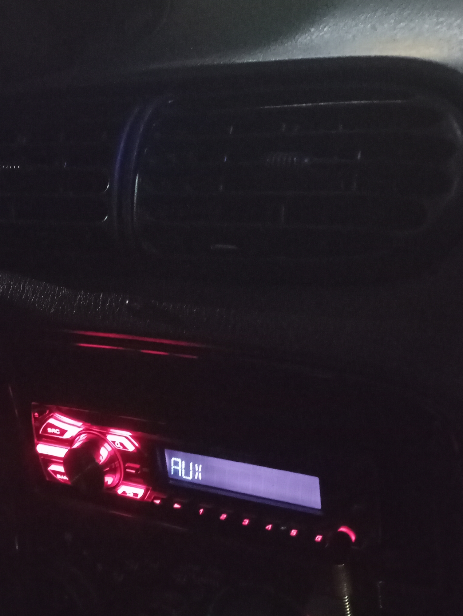Evening drive through Krasnodar's commercial district captured on dashboard
