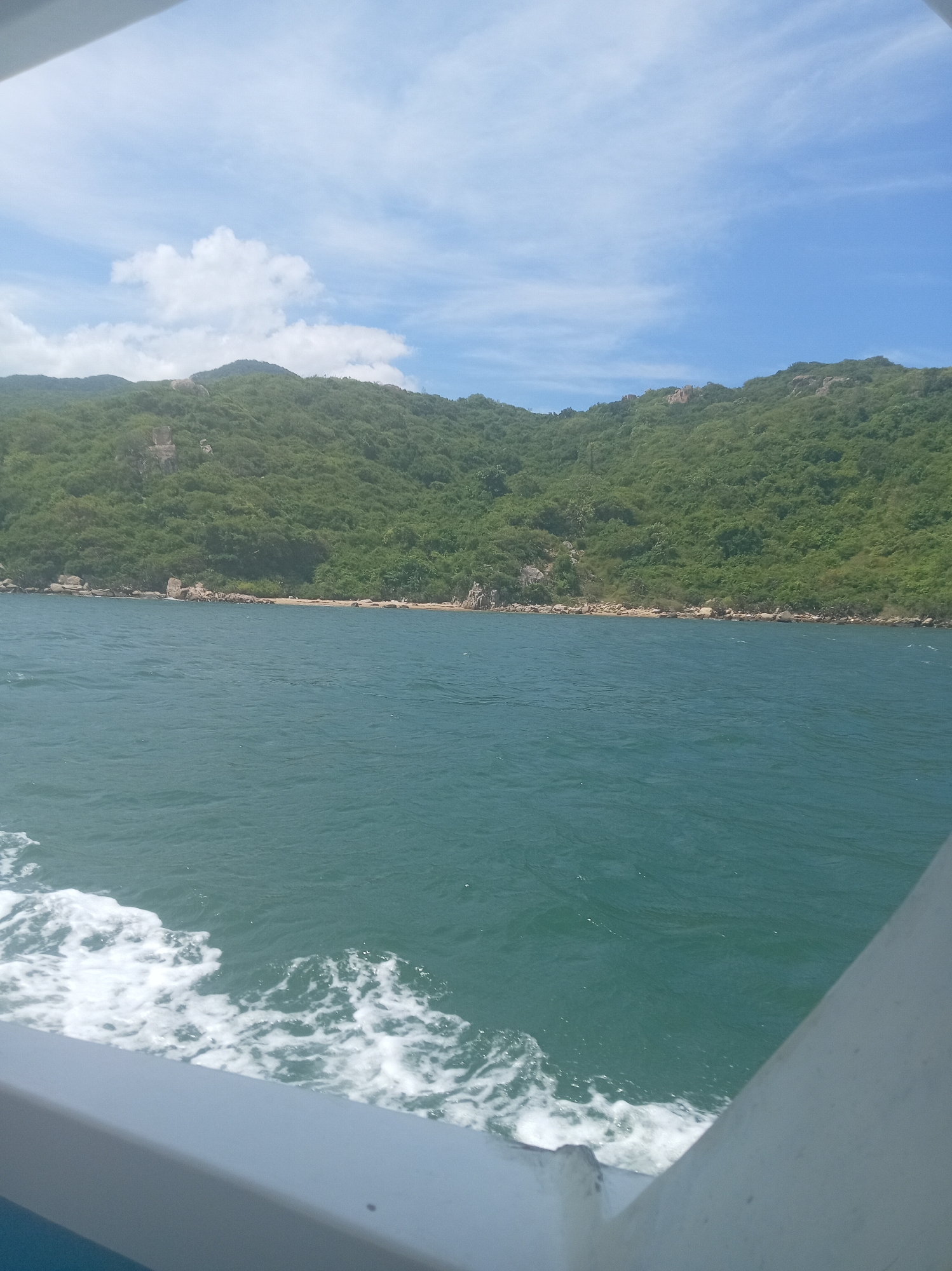 On the water near Vinh Hai's forested coastal hills