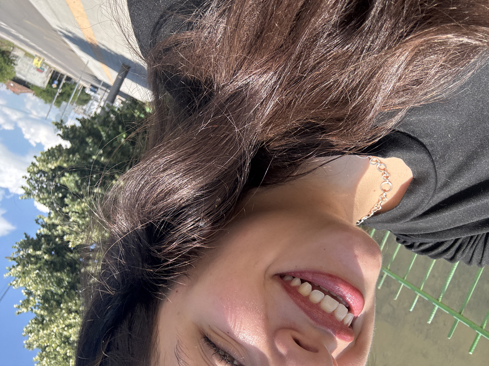 Sunny street stop: selfies, cobblestones, and a parked Porsche