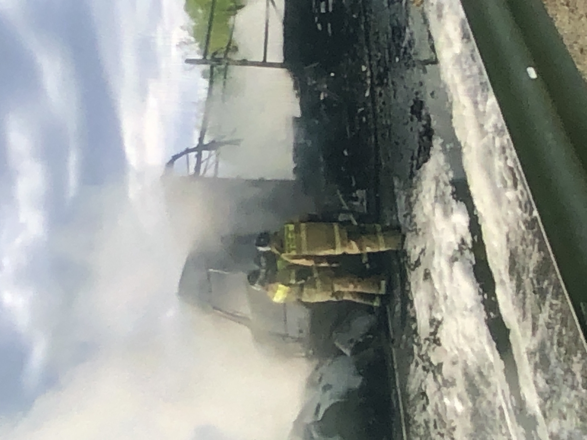 Spring morning captures firefighters, blooming trees, urban life
