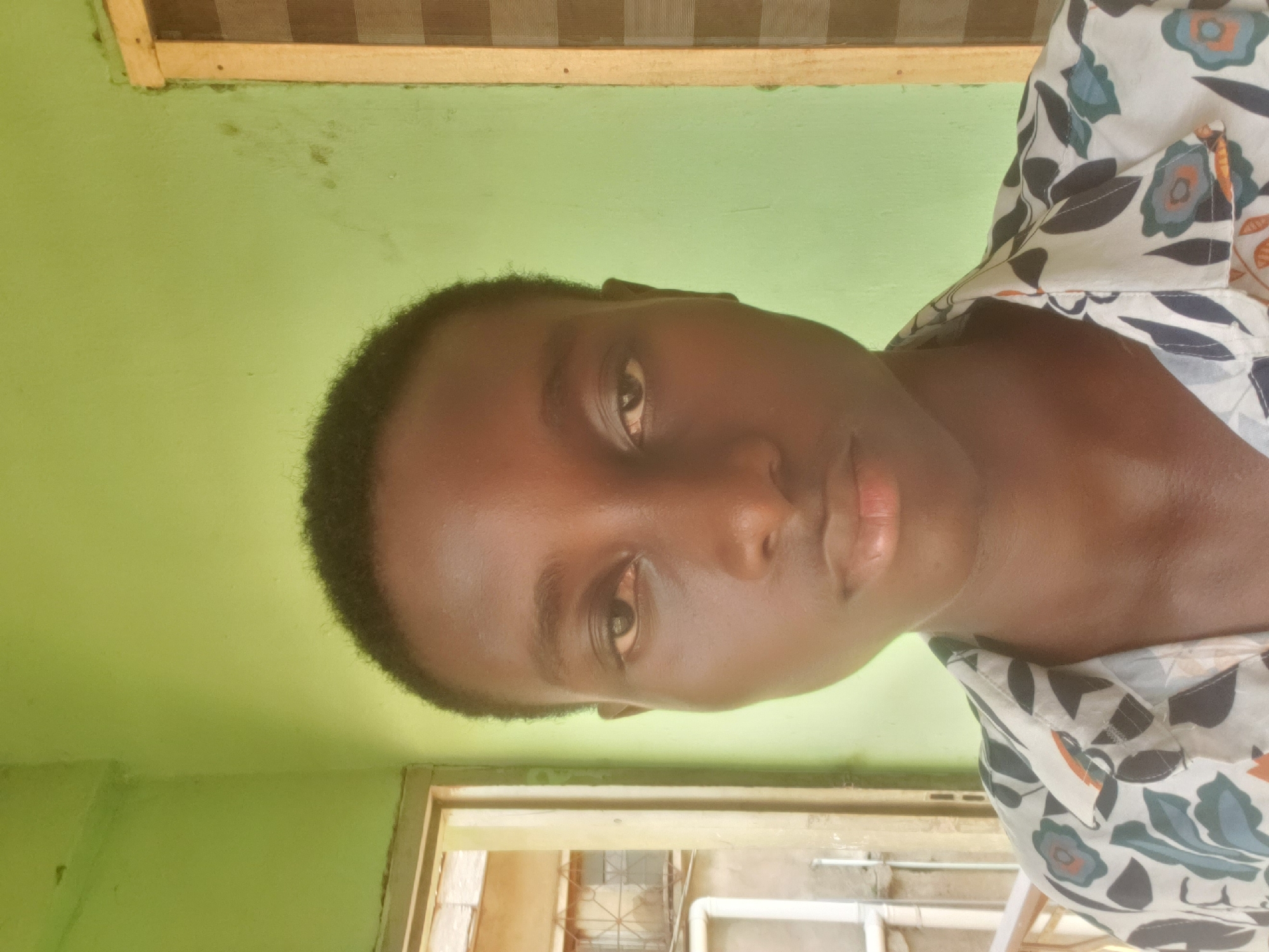 Young man documents casual gathering in Nigerian neighborhood