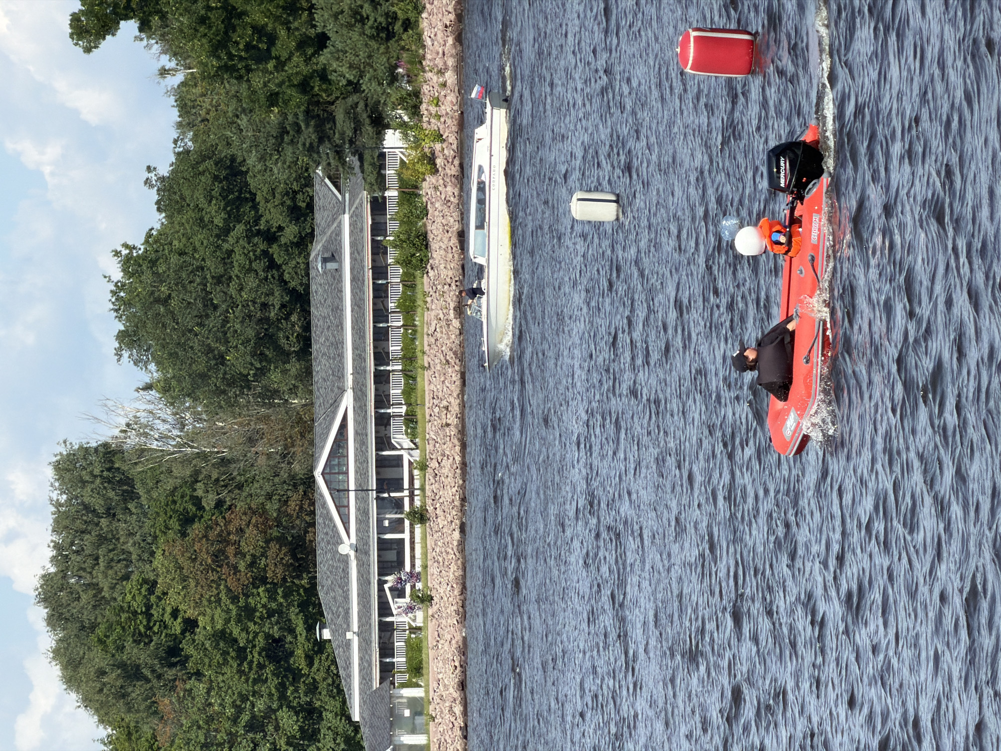 Sailboats moored at St. Petersburg marina, bridge and stadium in view