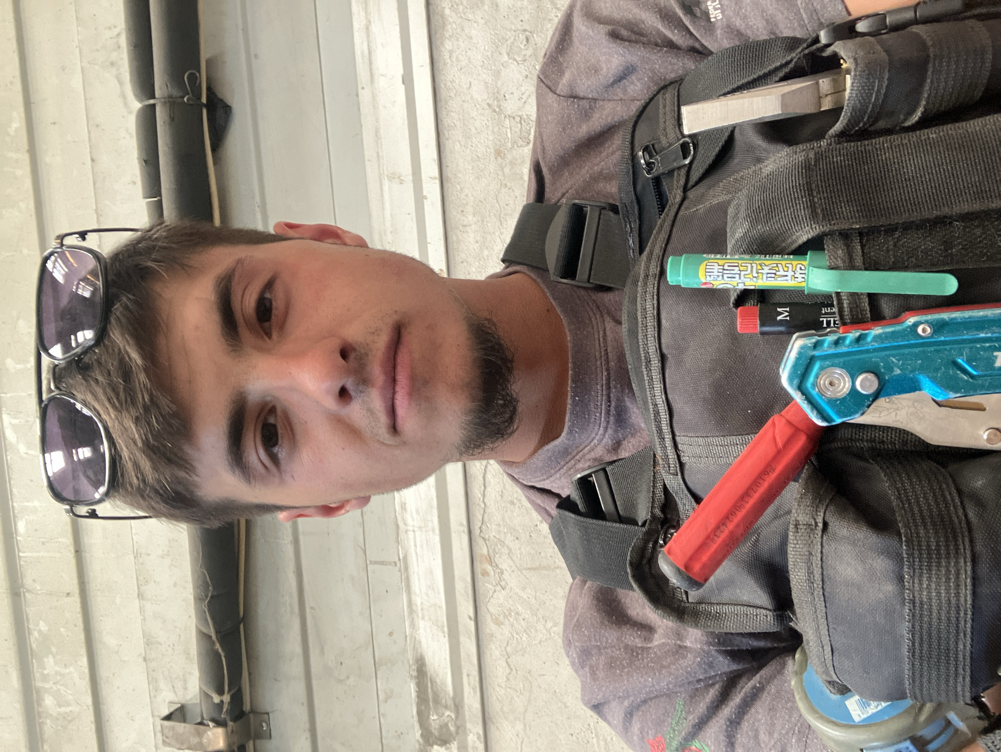 Construction worker documents industrial tank project in Haskovo, Bulgaria