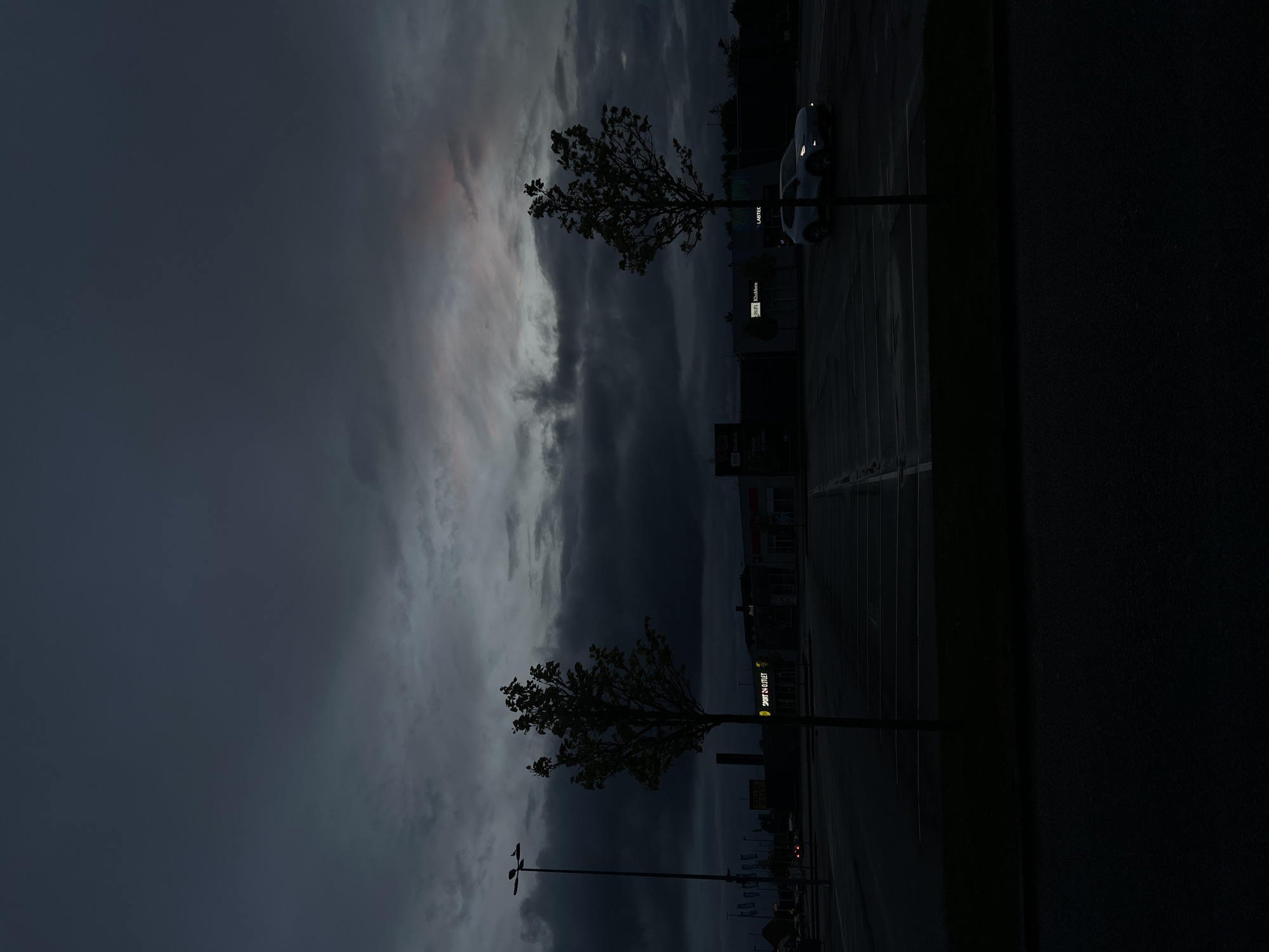 Dramatic cloud formations observed over Aalborg parking lot at dusk