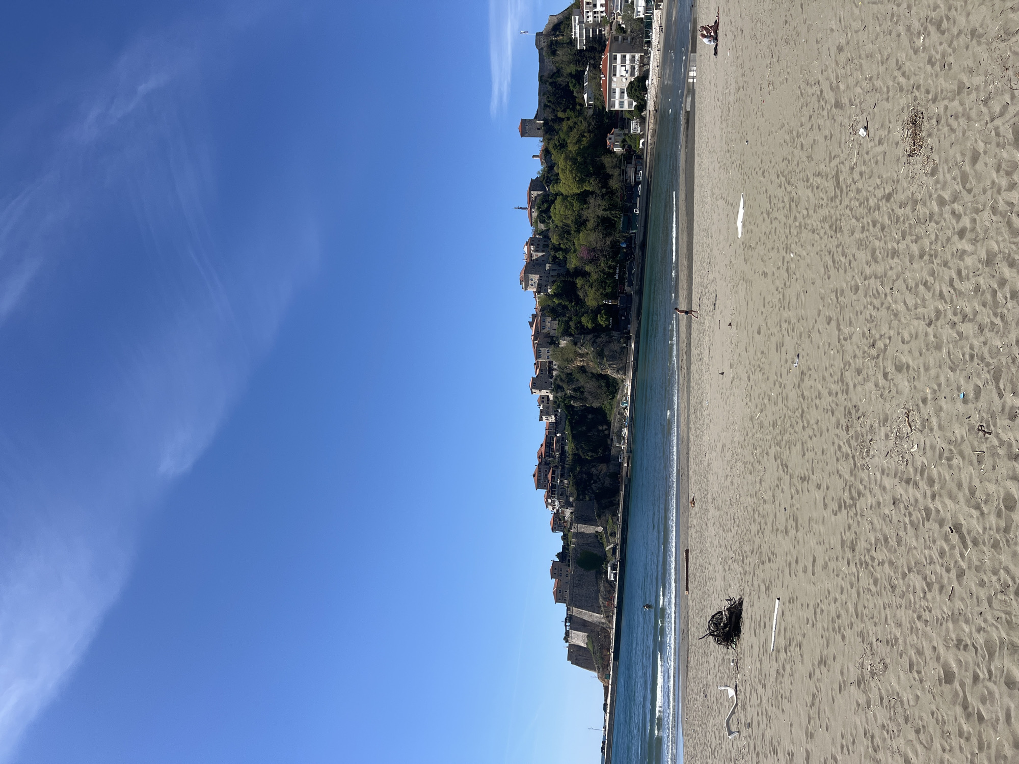 Coastal scene documented in Ulcinj, Montenegro showing beach debris