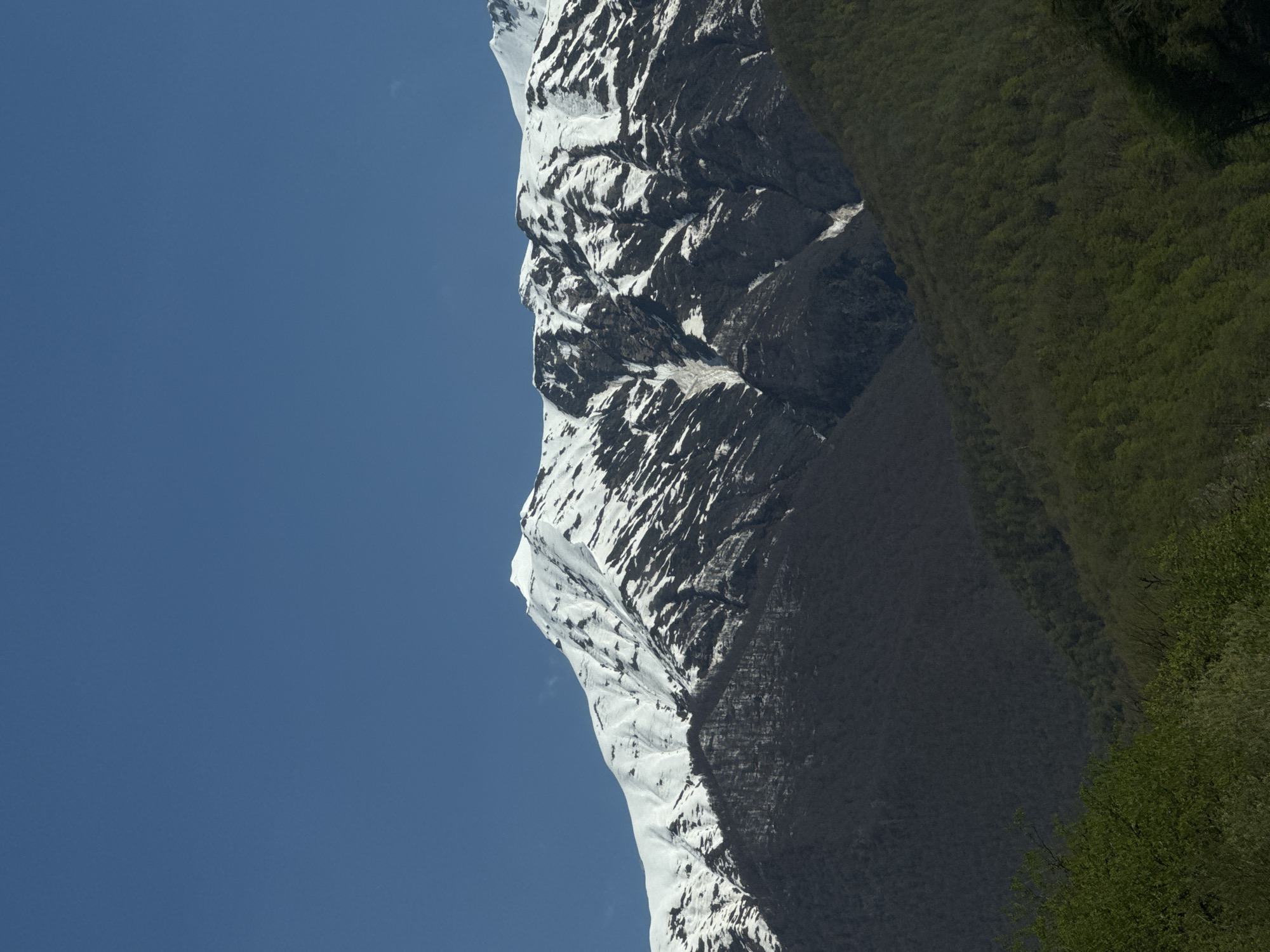 Snow-covered mountains observed under blue skies in Estosadok, Russia