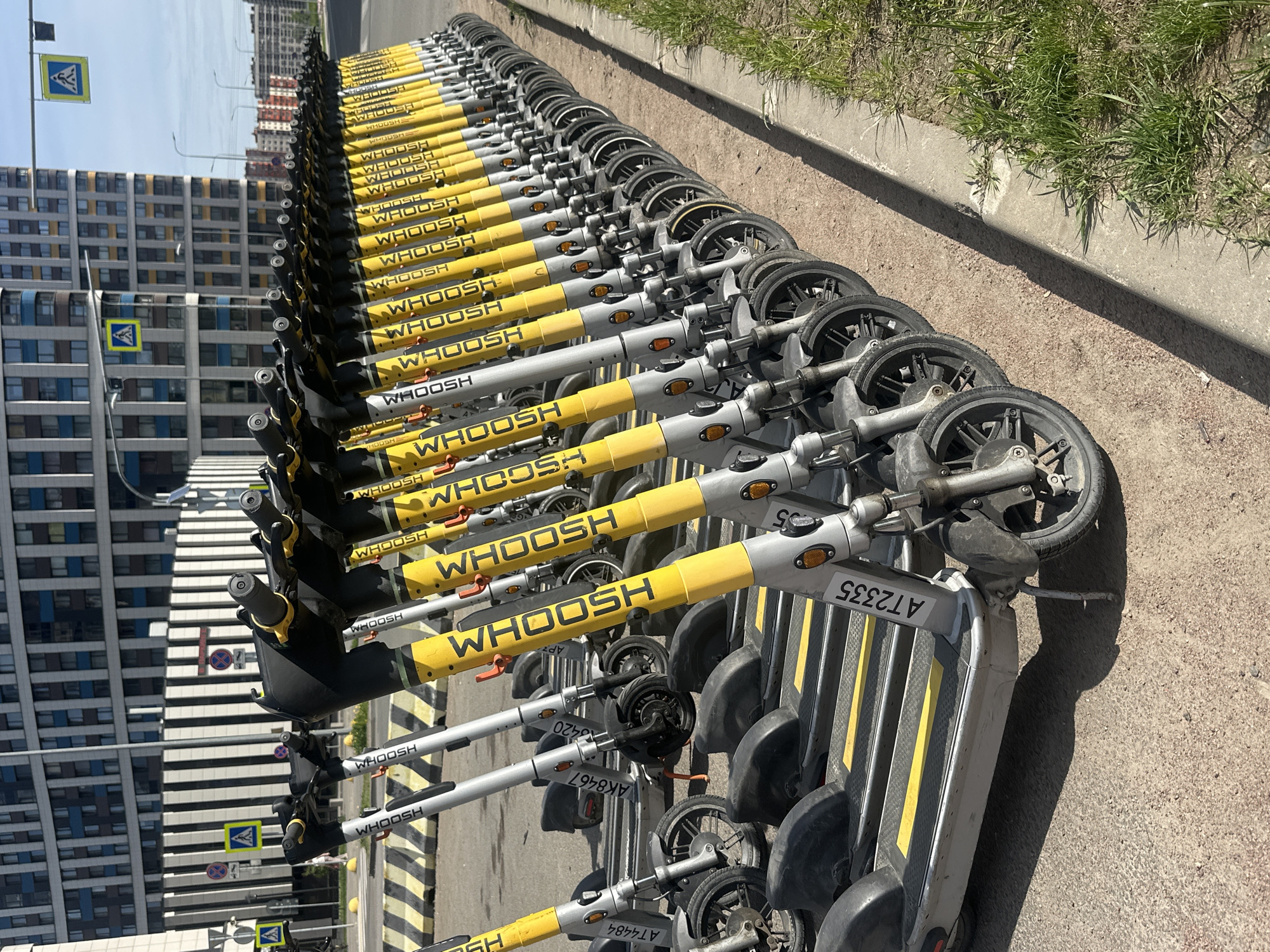 Electric scooters parked in orderly row in Murino, Russia
