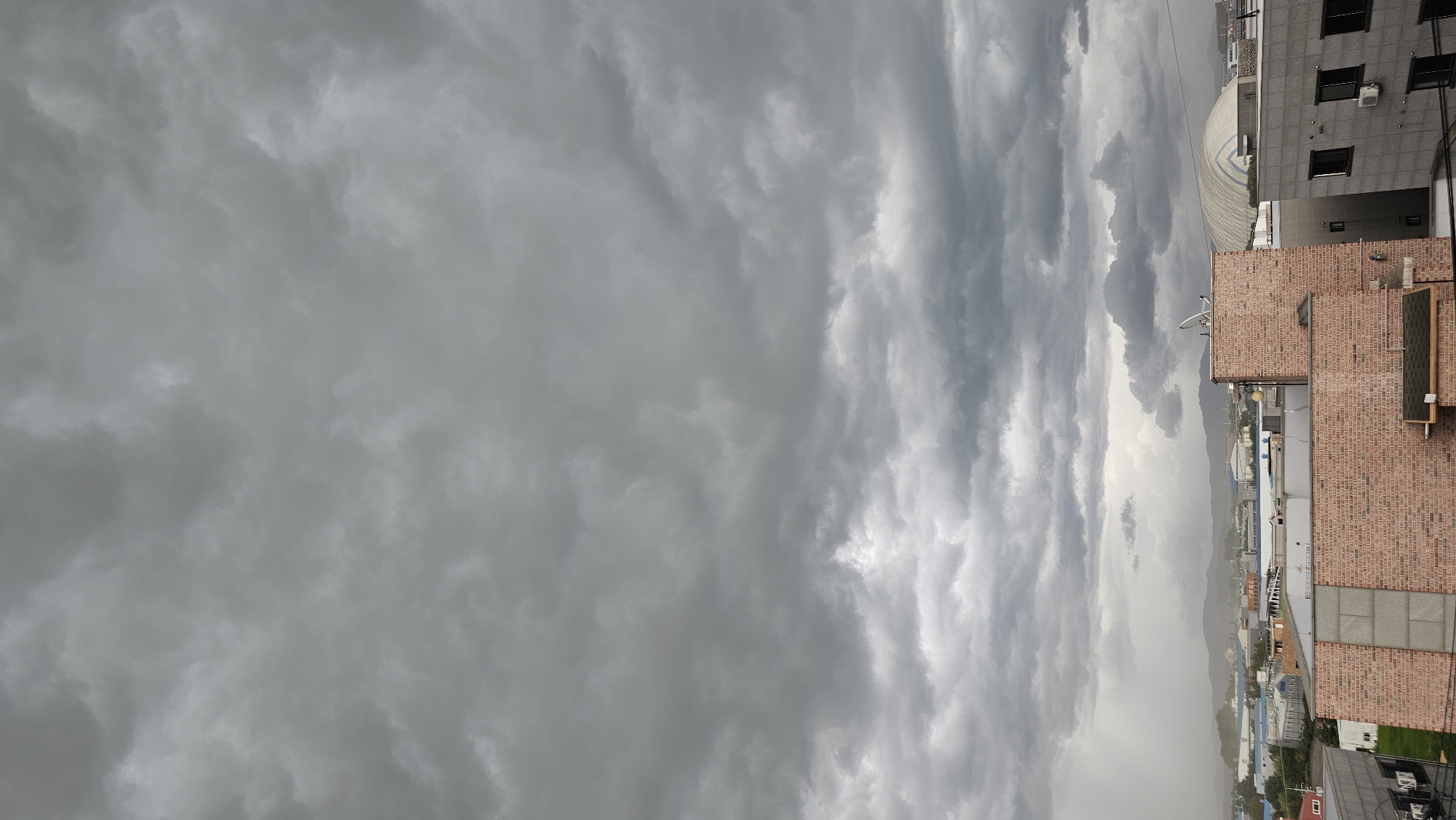 Storm clouds move over Asan-si on a grey August morning