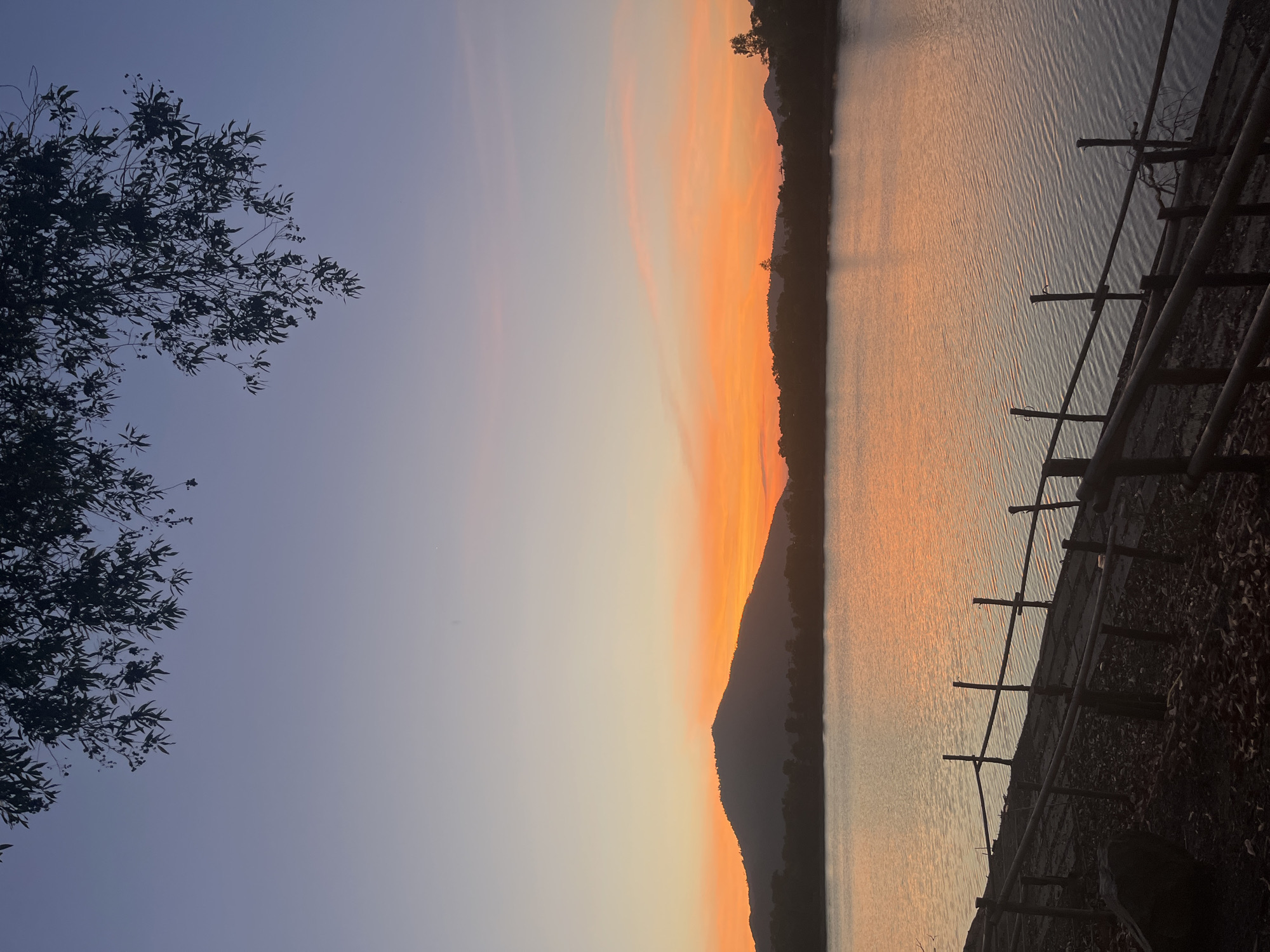 Peaceful sunrise captured over water in Baan Harn, Thailand