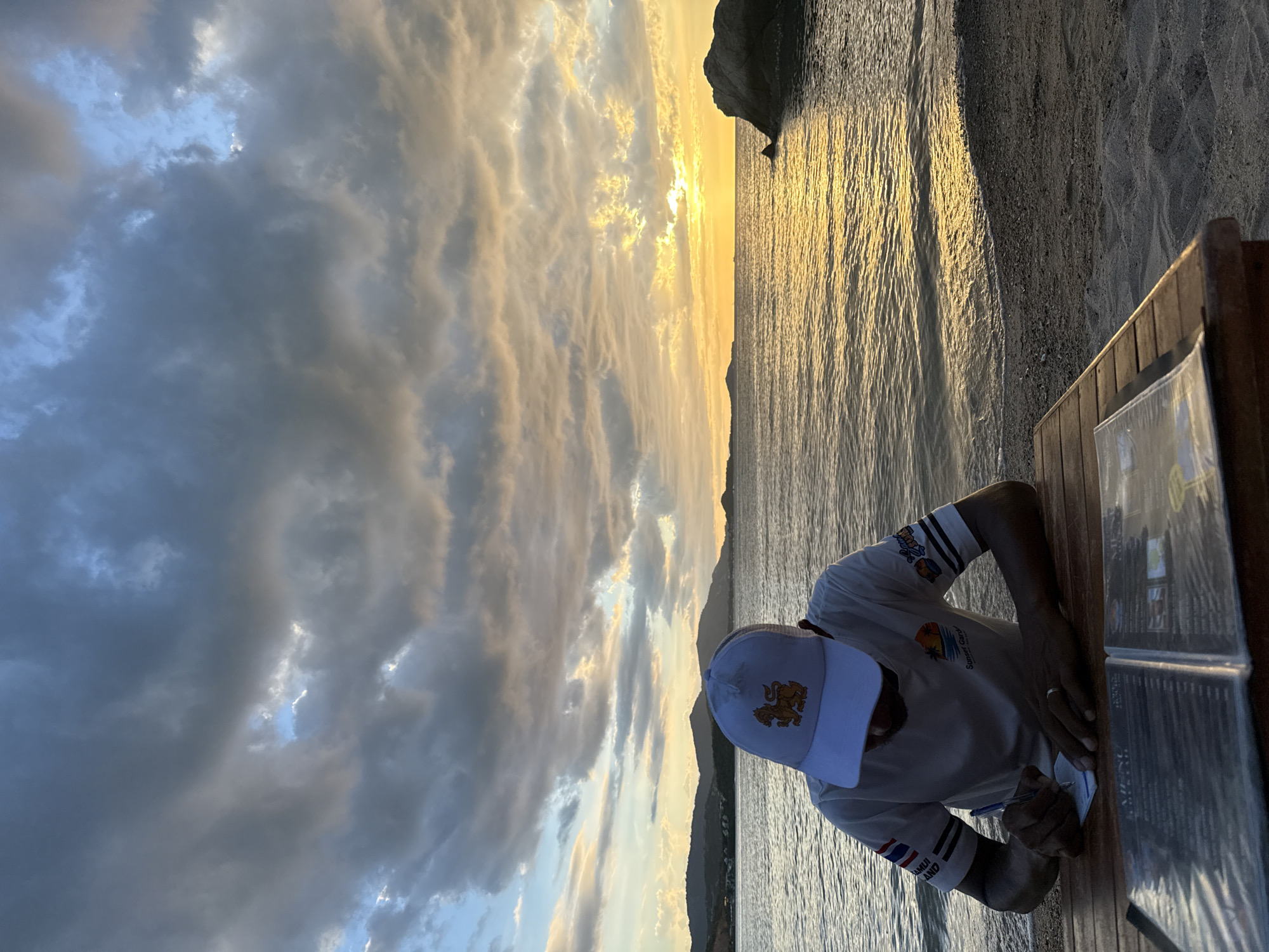 Golden hour at Baan Plai Laem — drinks, clouds, and temple grounds