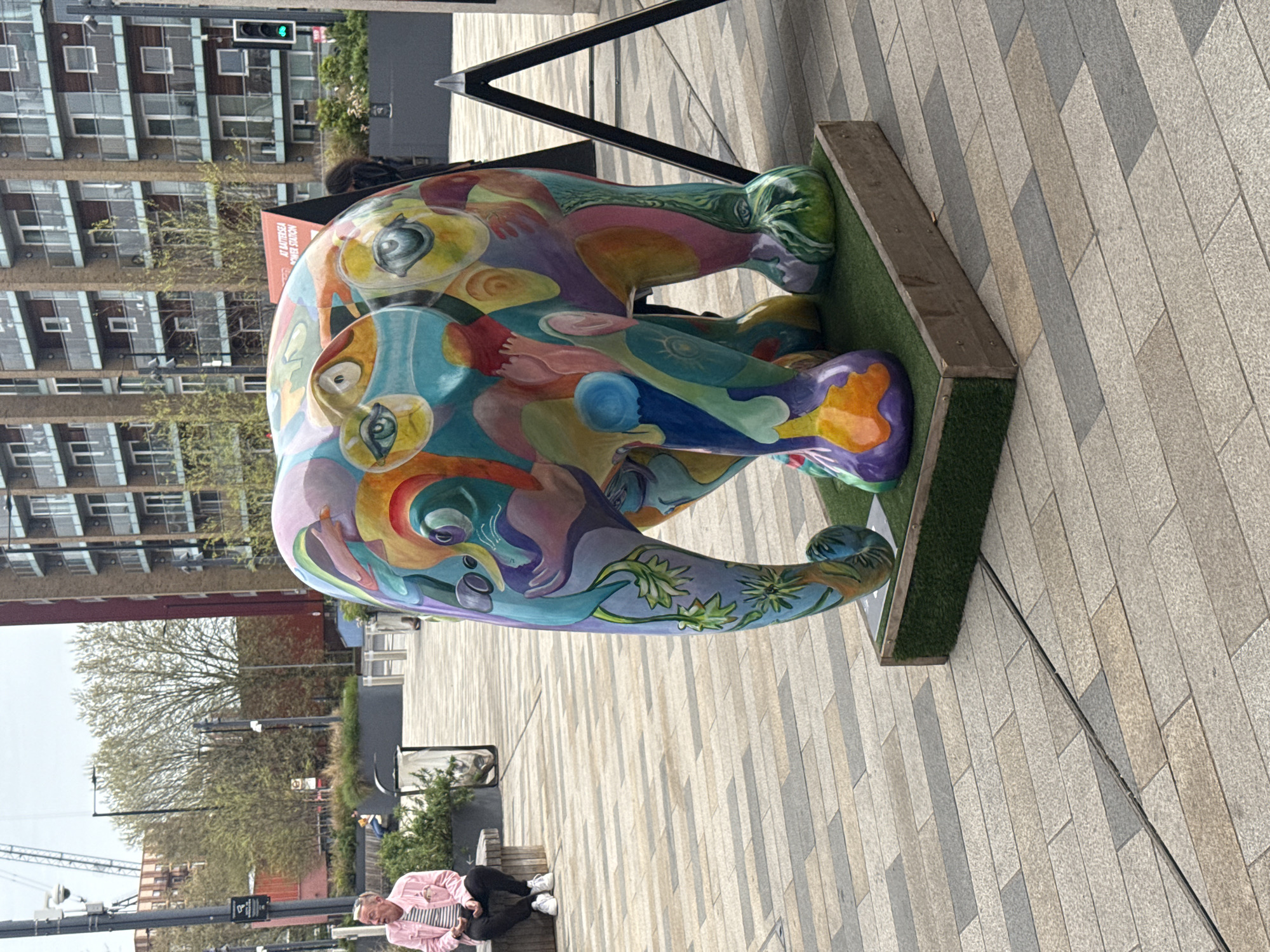 London park scene captured: elephant art, food truck, coffee