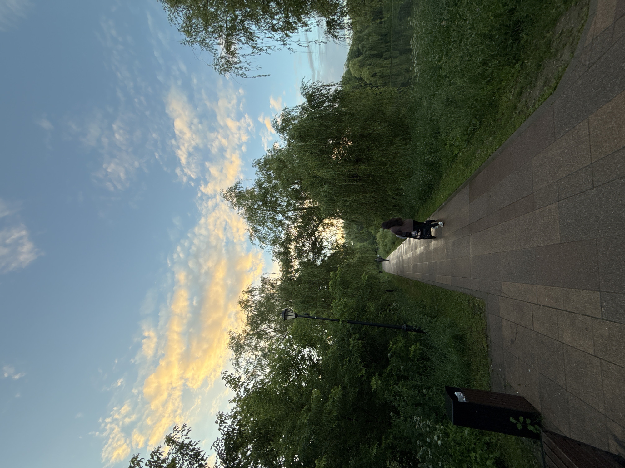 Evening stroll through a Moscow park at golden hour