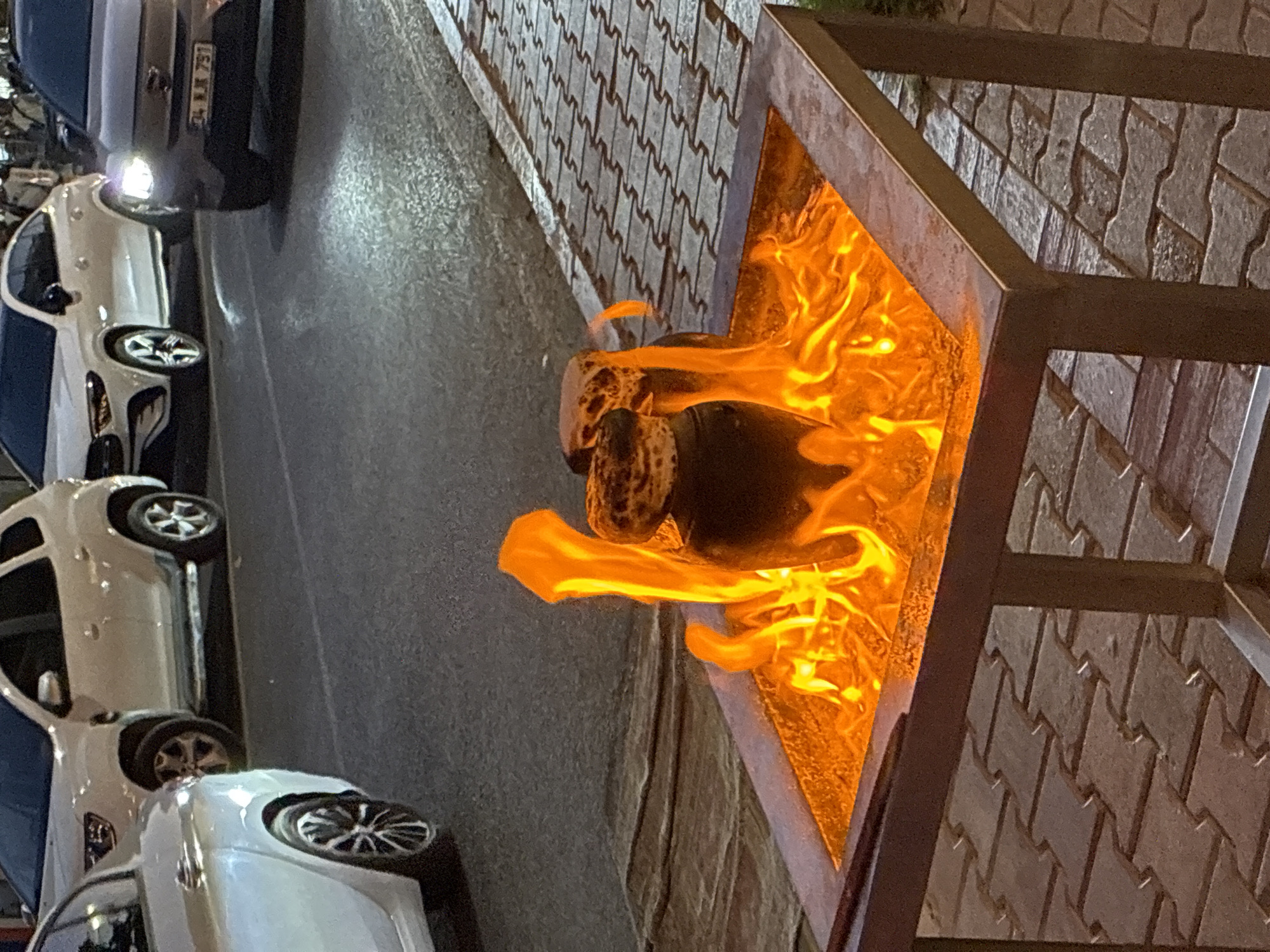 Fire pit and cable car scene along Alanya's walkway