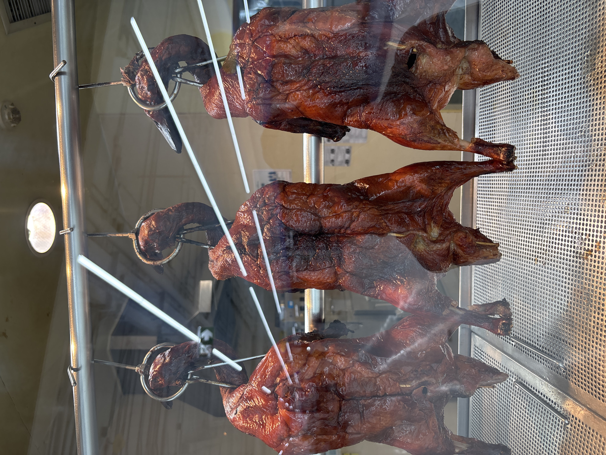 Roasted ducks displayed in glass case, Baan Bo Phut