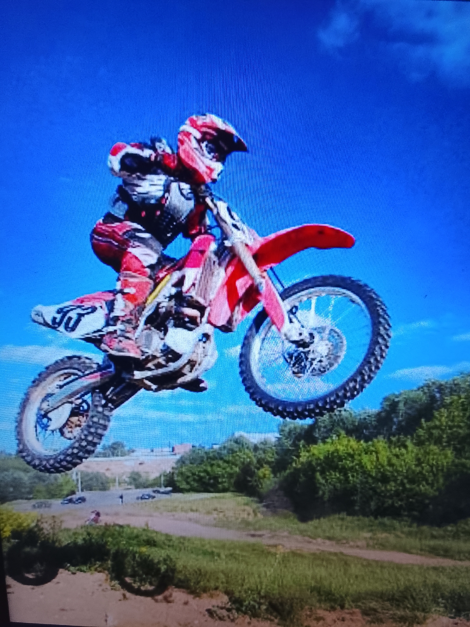 Motocross riders catching air and dirt on the track