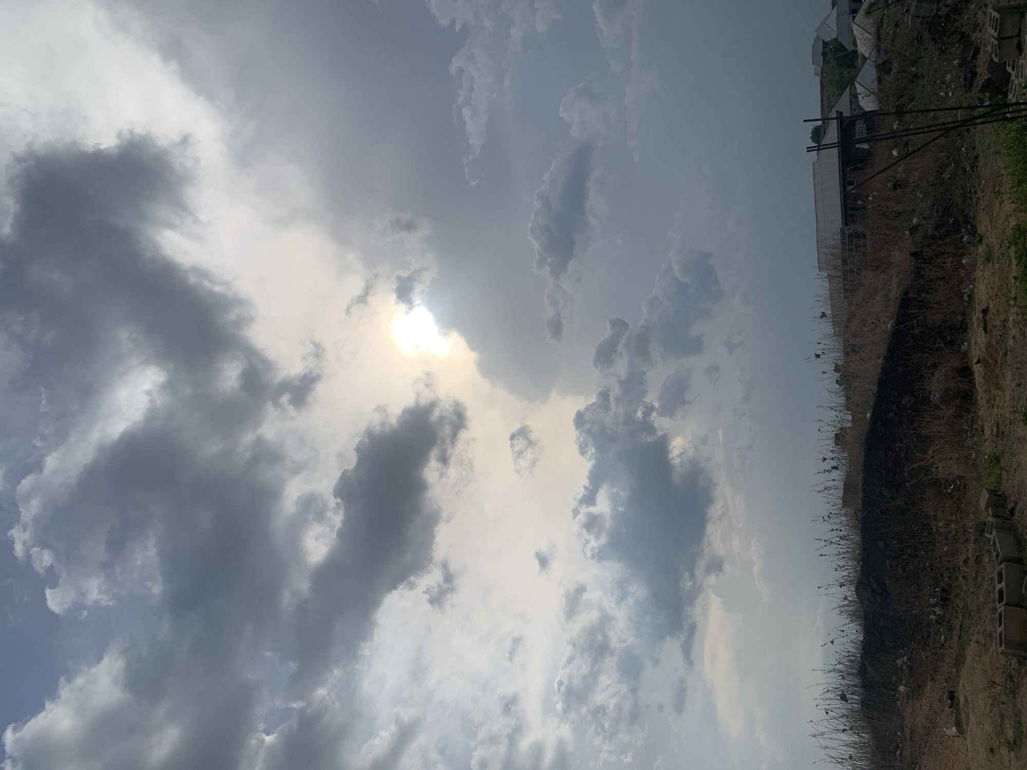 Cloudy skies and settlement views documented in Lokoja, Nigeria