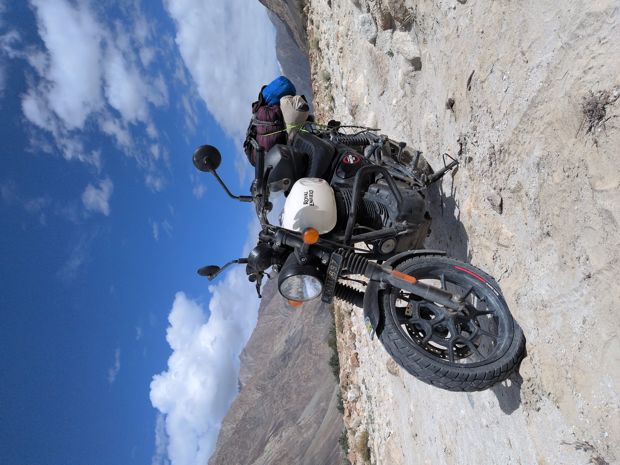 Royal Enfield parked deep in Ladakh's arid mountain terrain