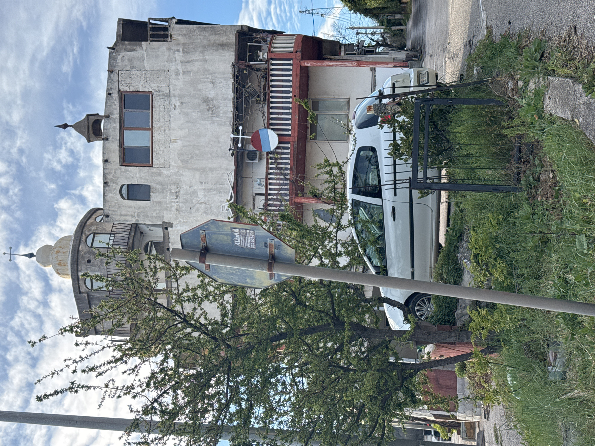 Aged three-story building documented in Zgrade, Montenegro street scene