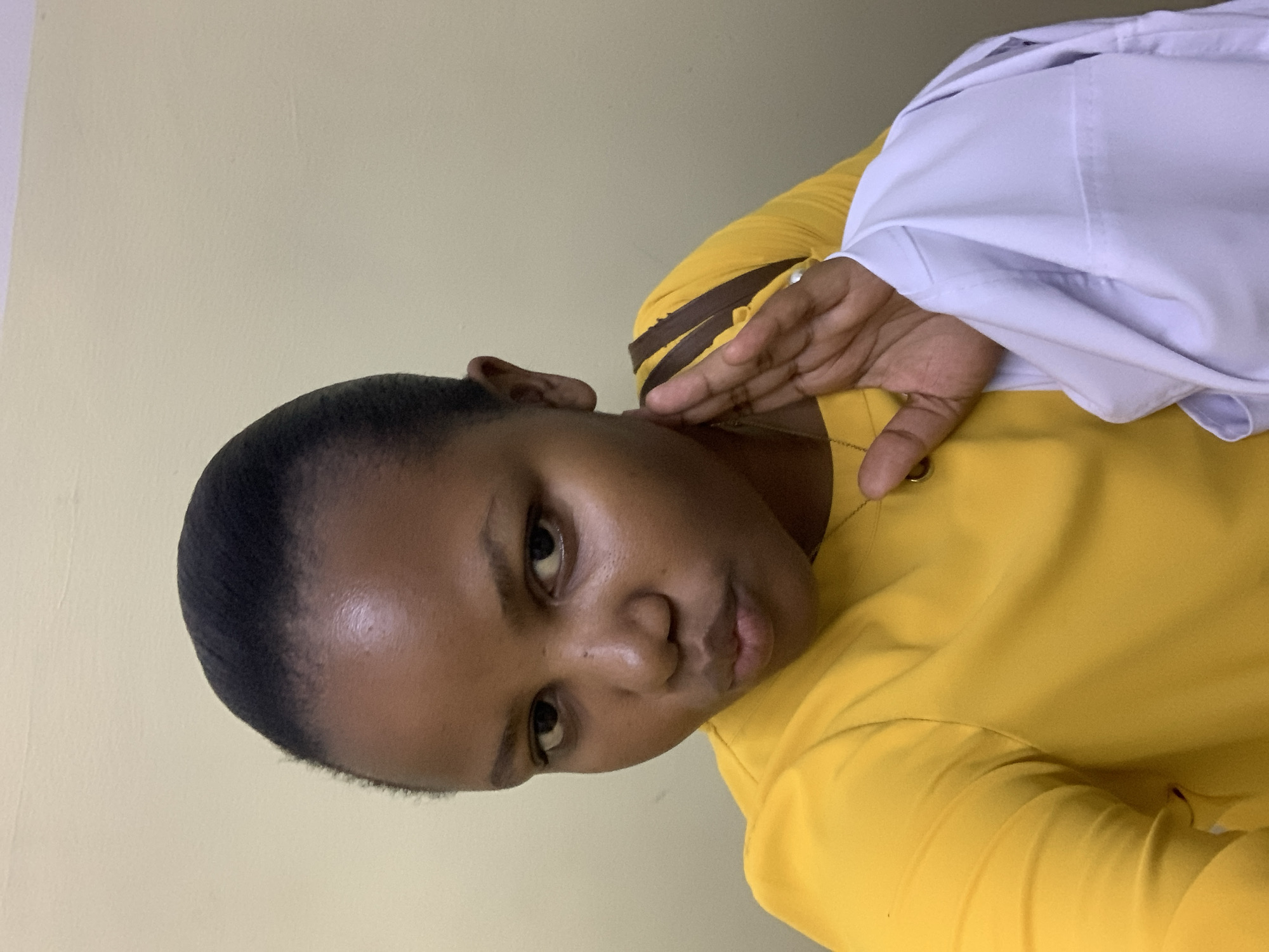 Woman photographed multiple times in yellow blouse, Dar es-Salaam