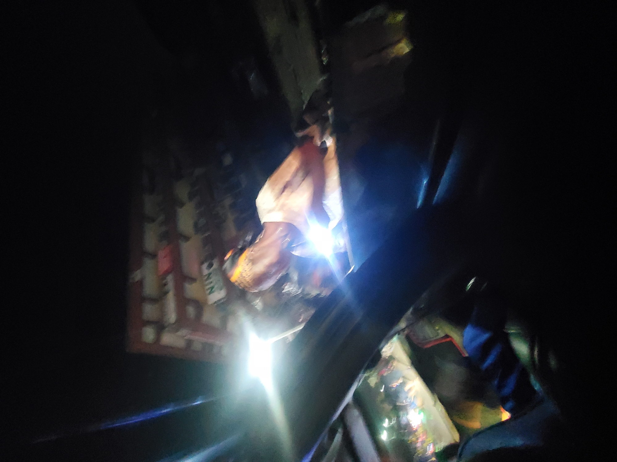 Man illuminated by bright light inside vehicle in Fegge