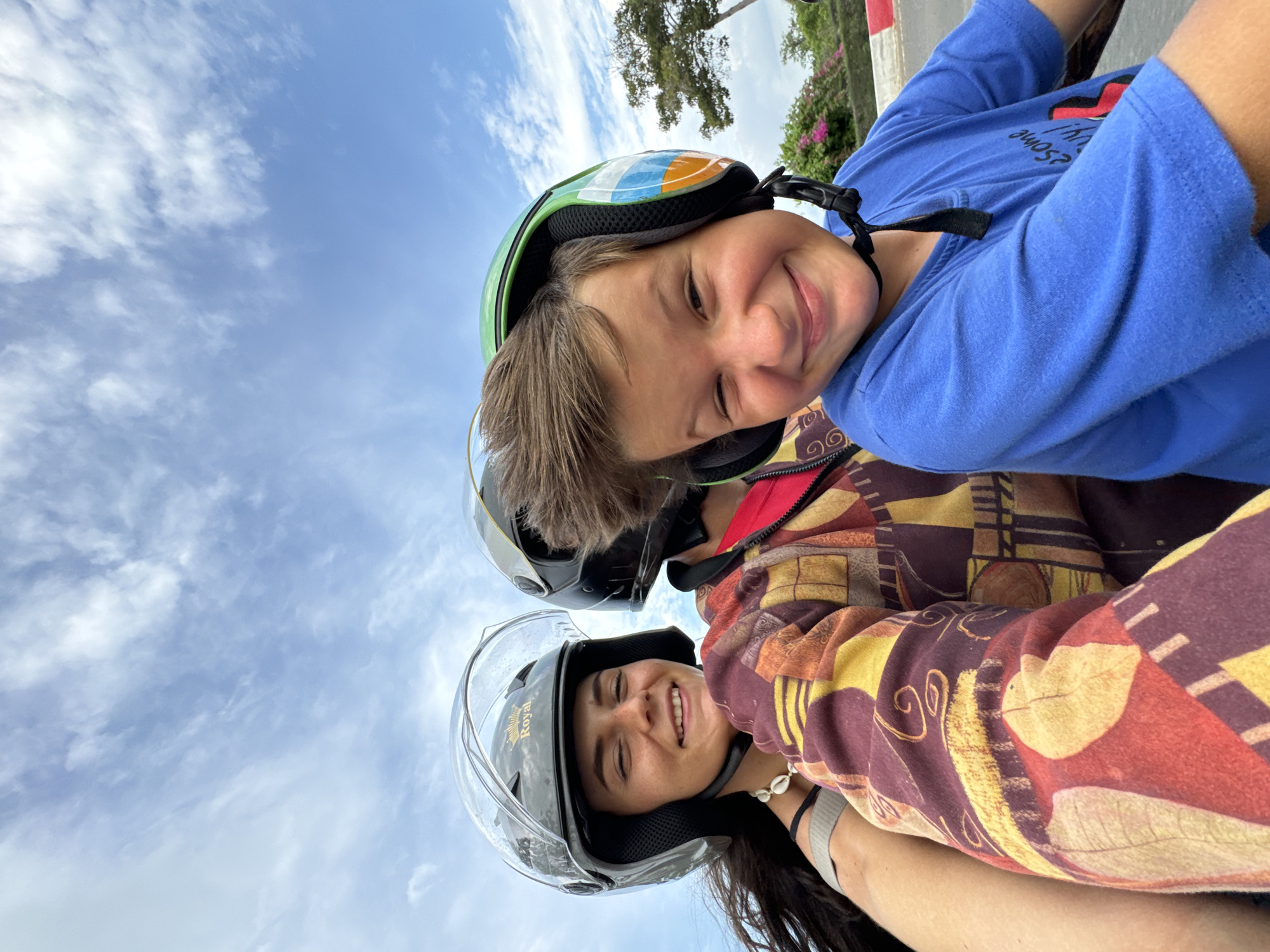Helmeted pair enjoys outdoor morning in Mui Ne, Vietnam