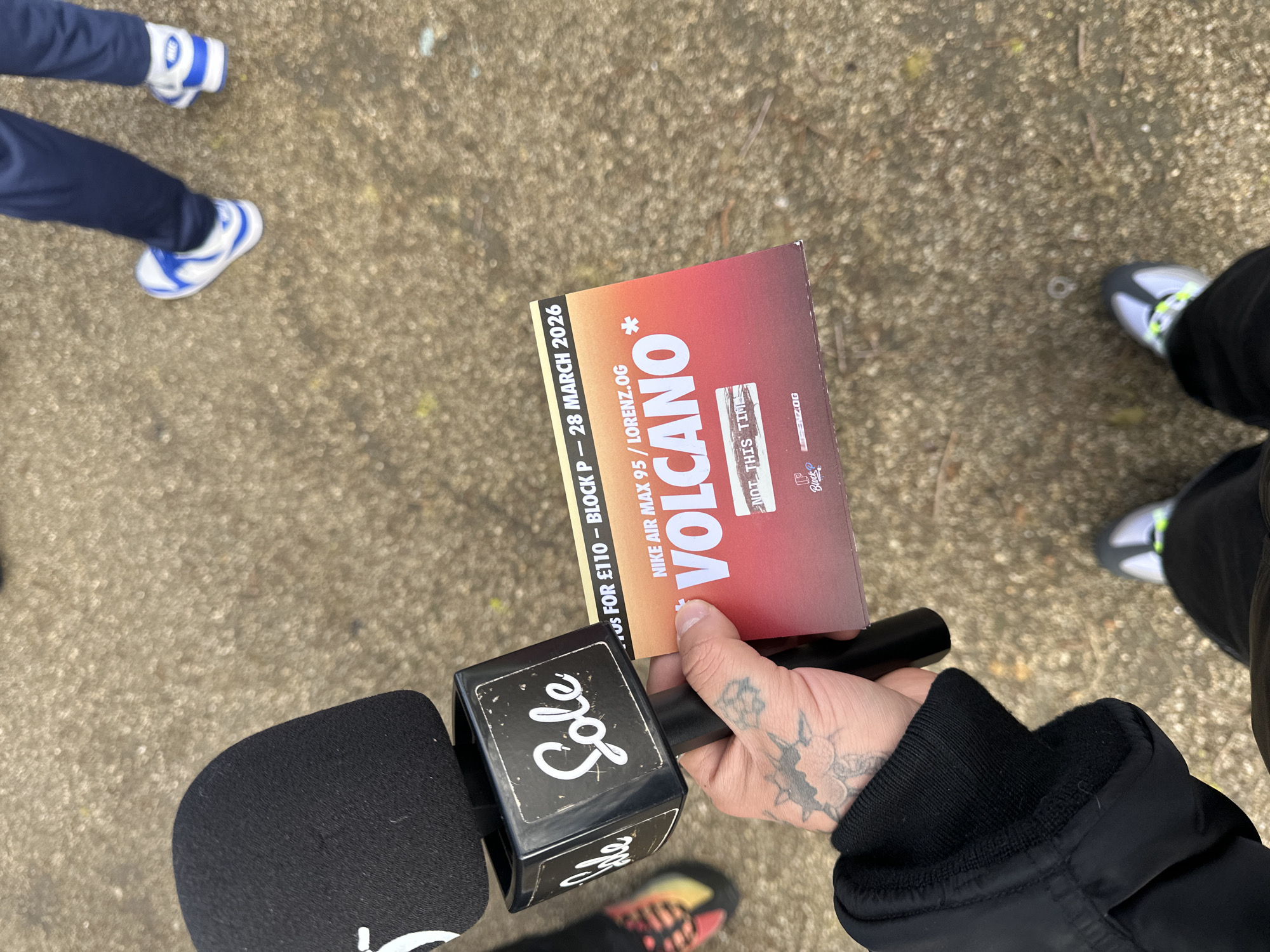 Outdoor gathering with microphone draws crowd in Liverpool park