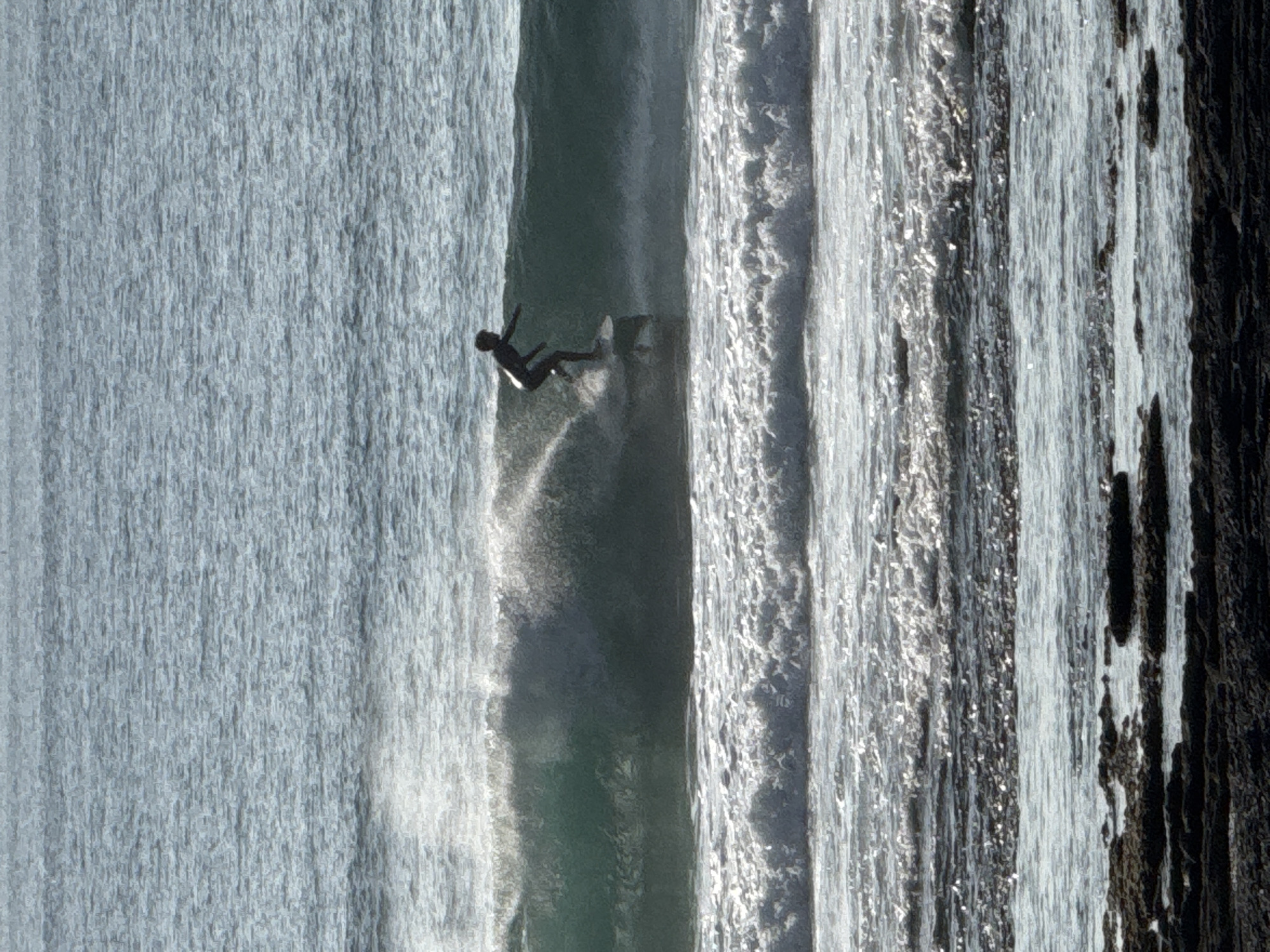 Surfers and beachgoers on Tenerife's south coast