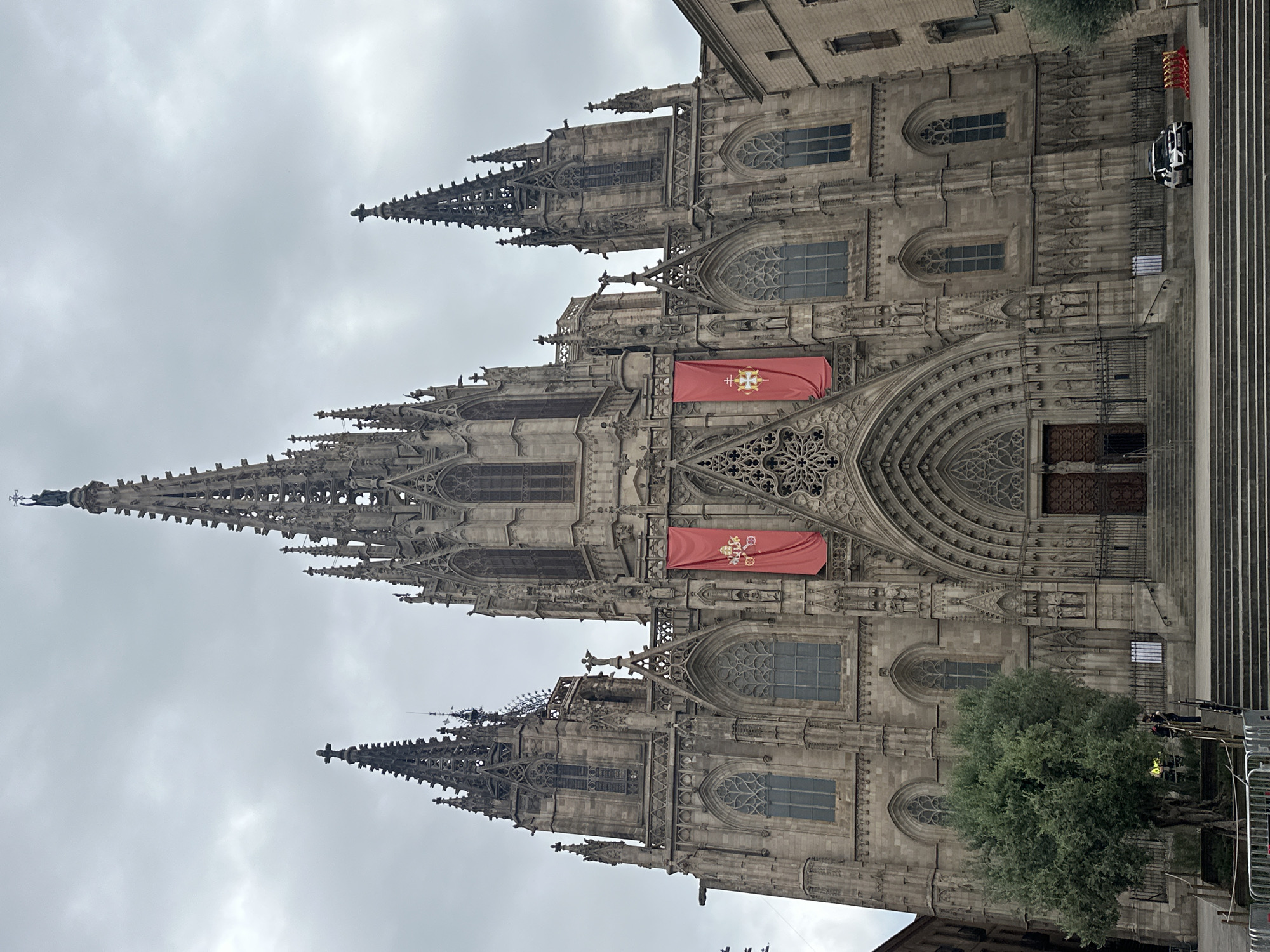 Tourist documents Barcelona's historic center during morning walkabout