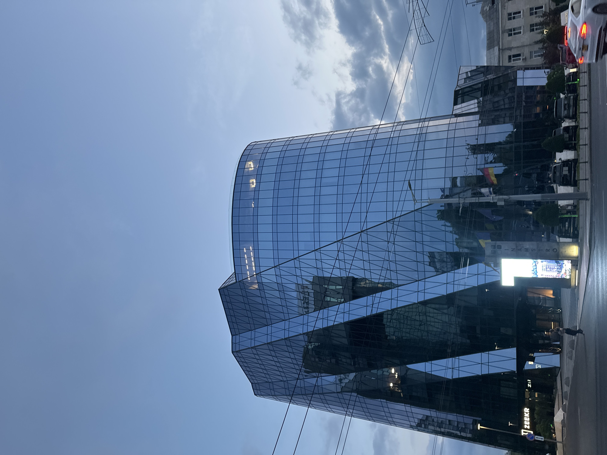 Dusk settles over a glass skyscraper in central Chișinău