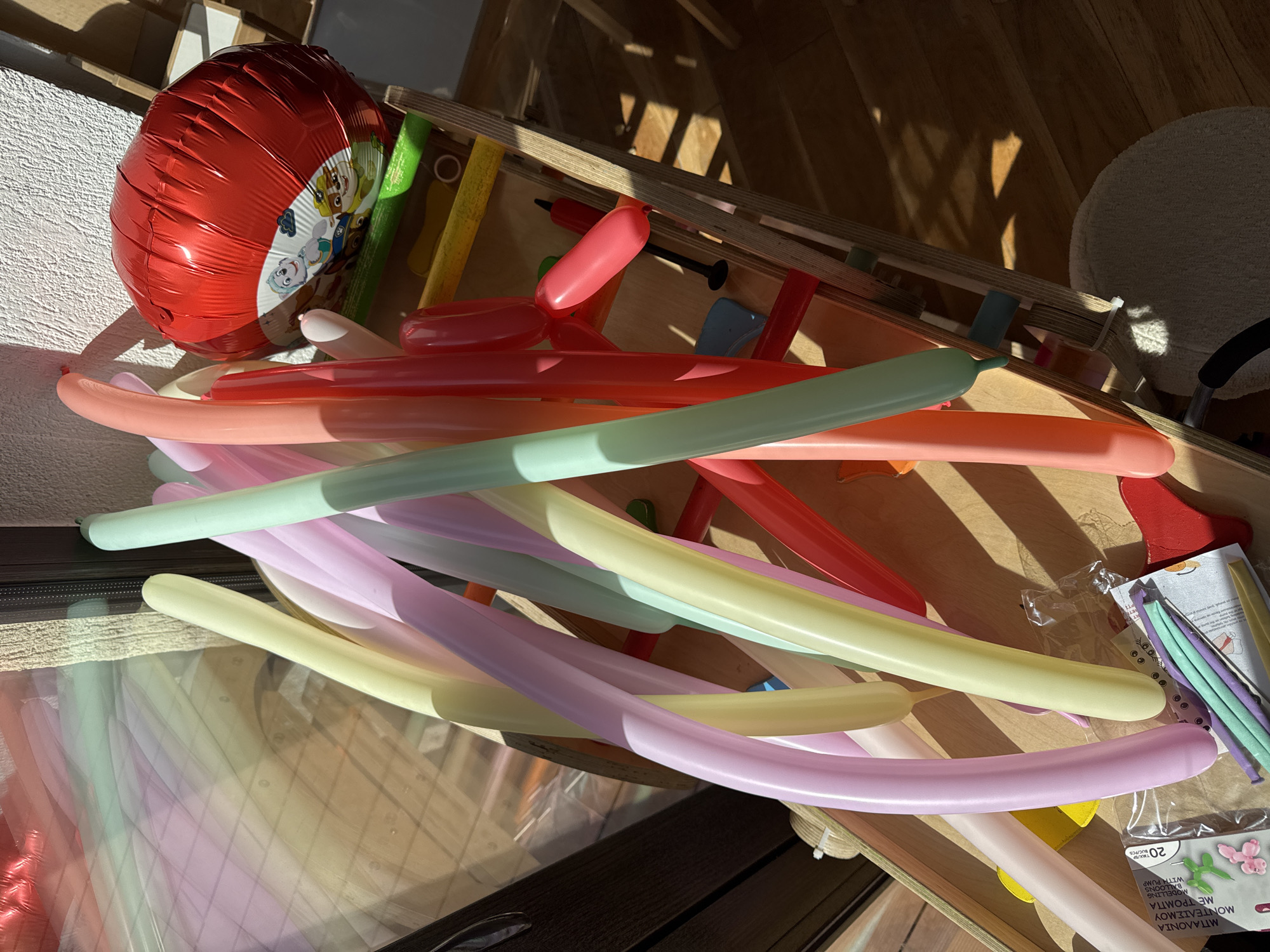 Person inflates modeling balloons in Sofia Friday morning