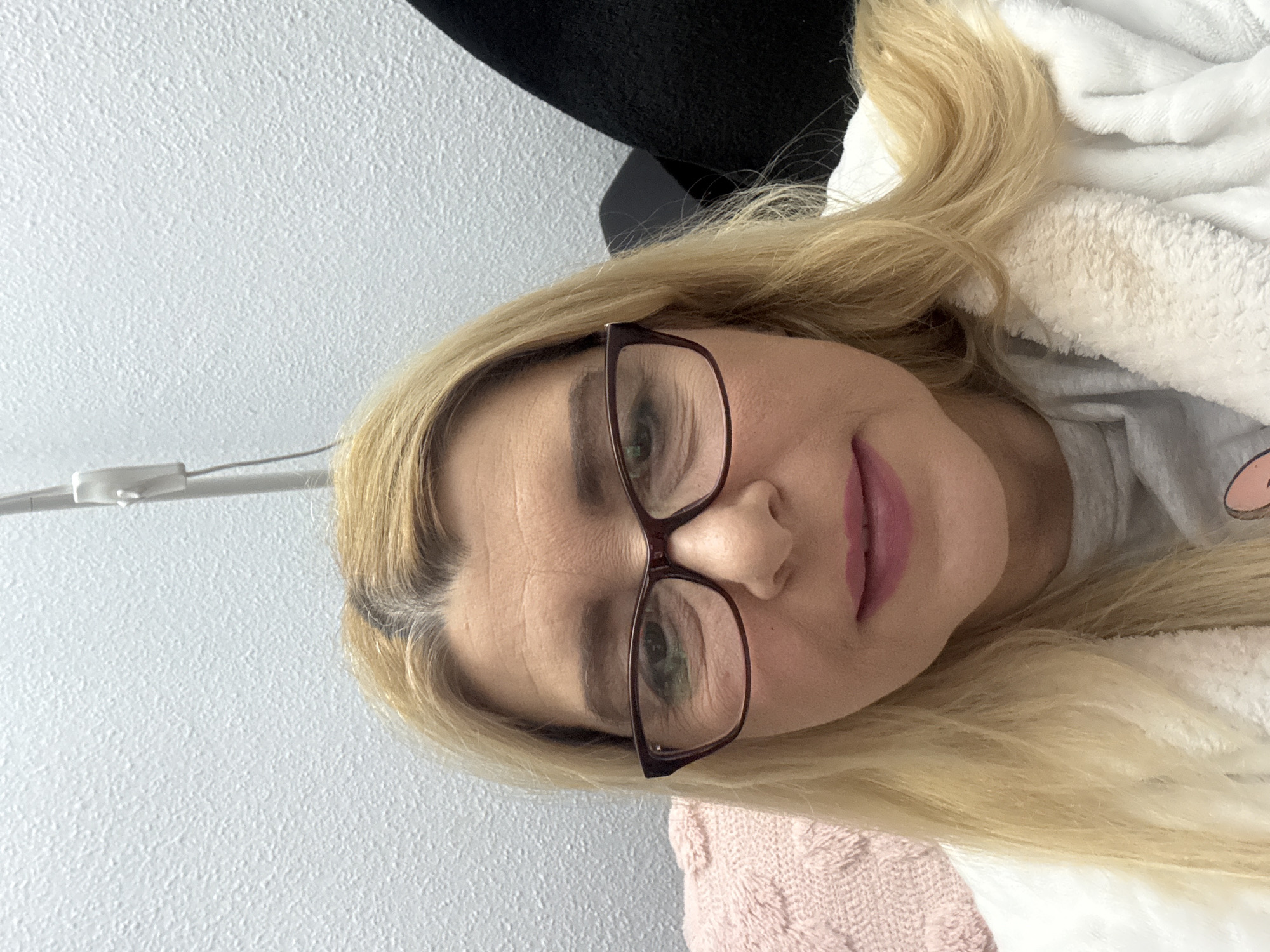 Woman in white robe photographed indoors April 9