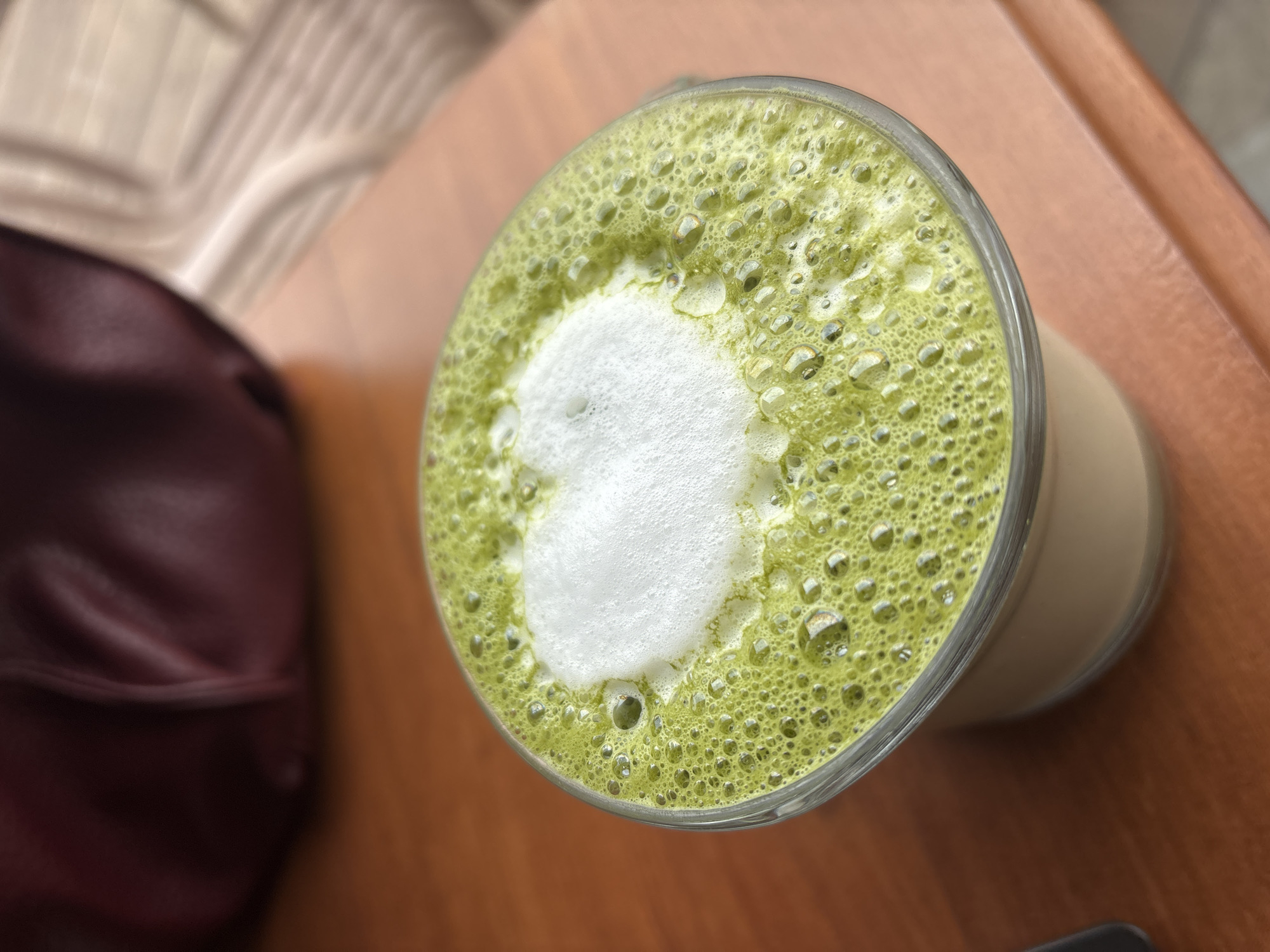 Matcha latte with heart foam art photographed in Varna