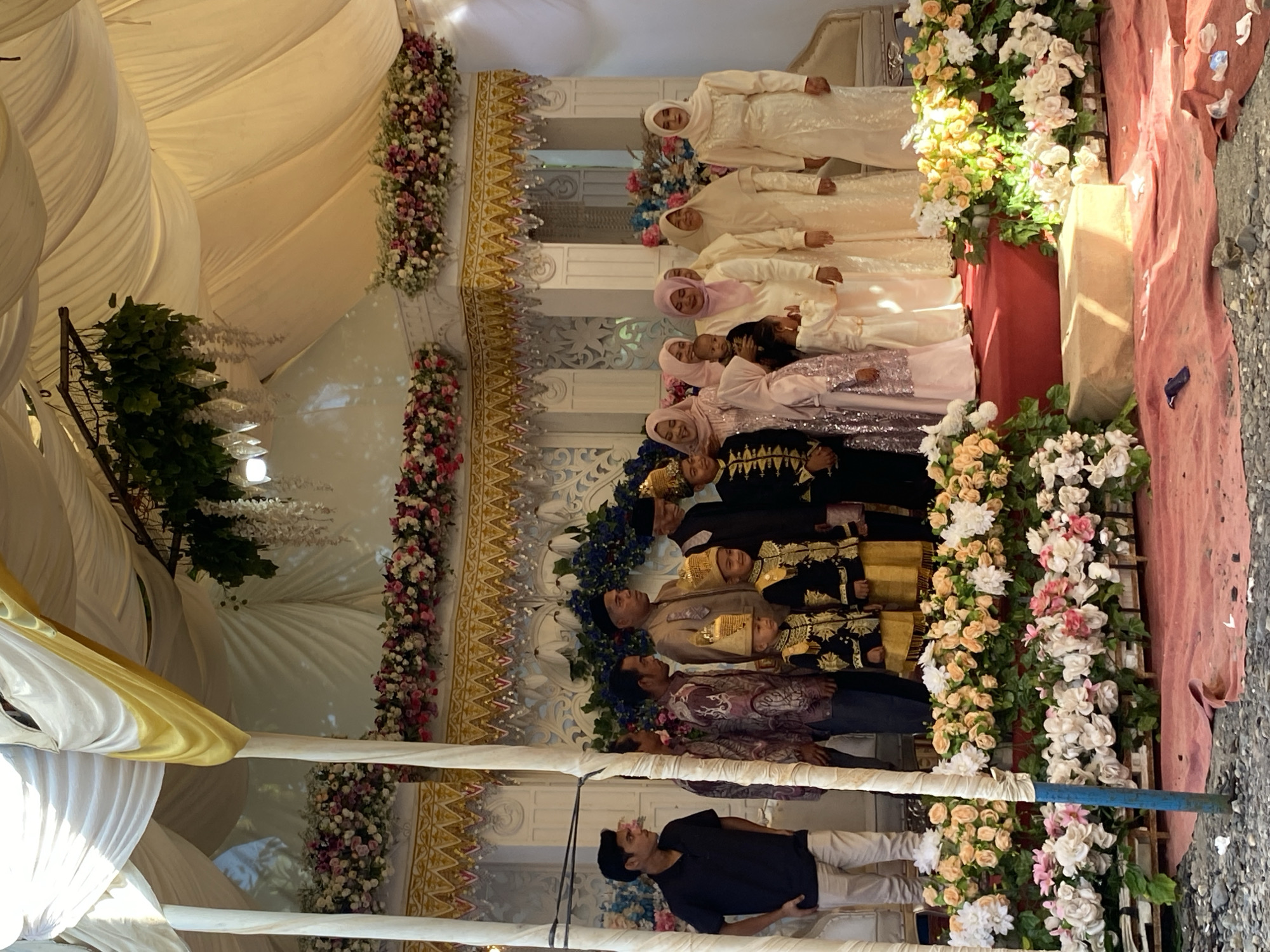 Traditional outdoor celebration with tents and ornate decor, Indonesia
