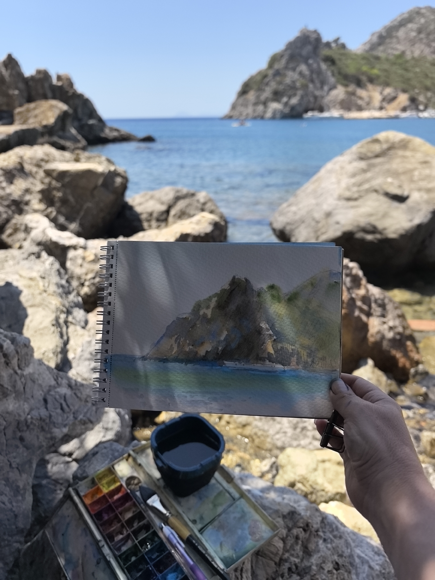Watercolor painting in progress on the Datça shoreline