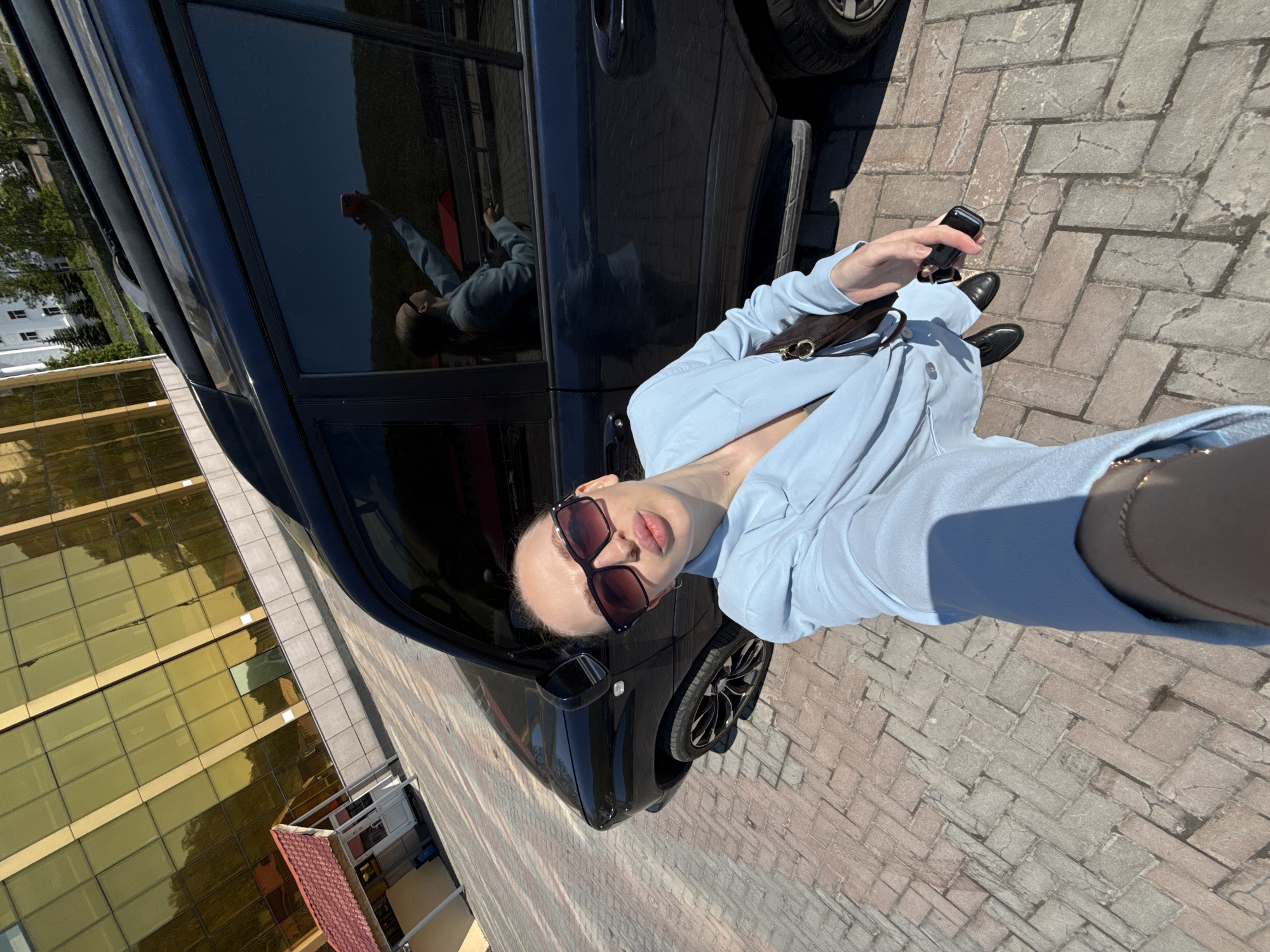 Woman takes selfie in sunny Petropavlovsk-Kamchatsky