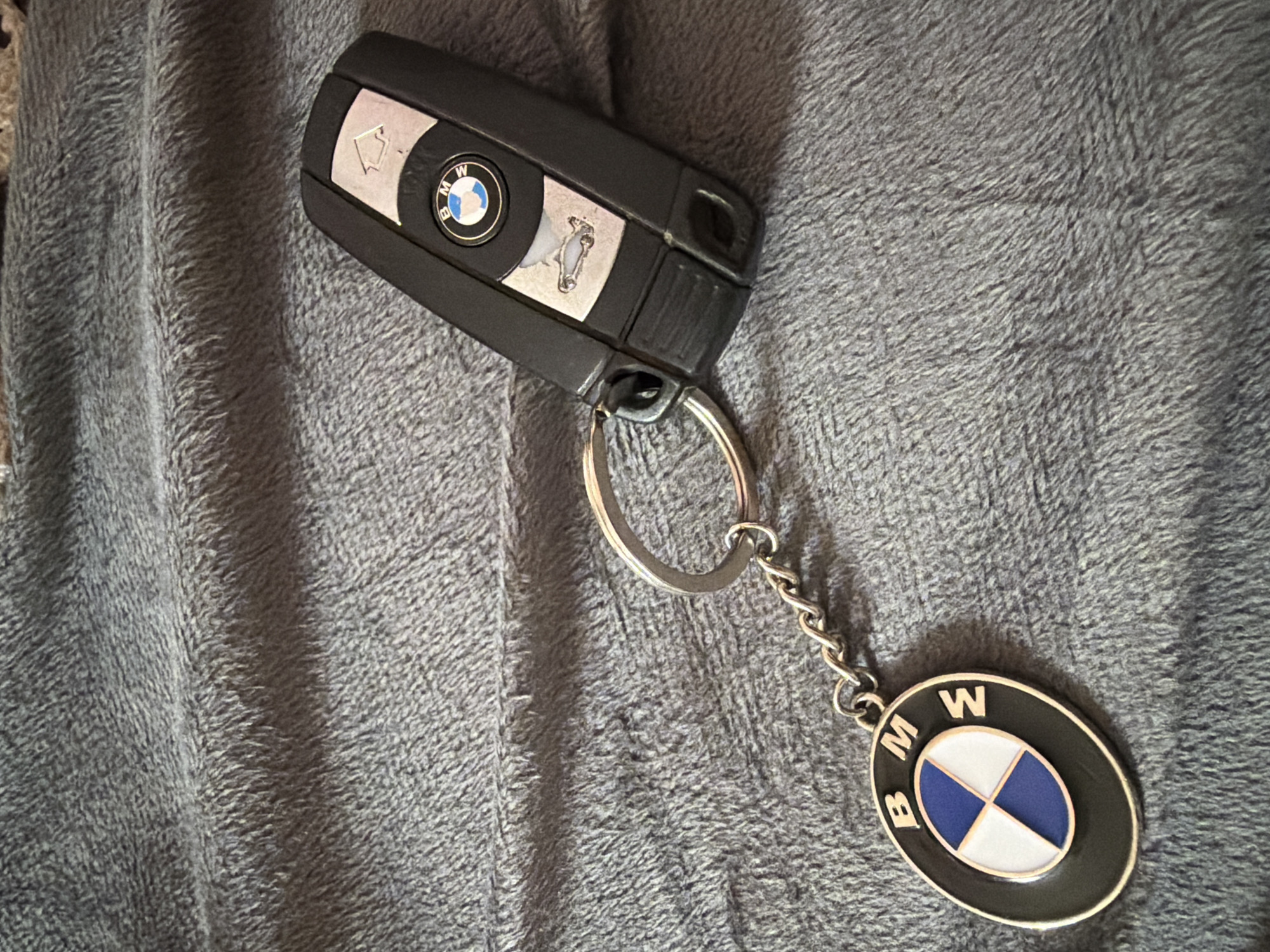 BMW car key spotted on gray surface