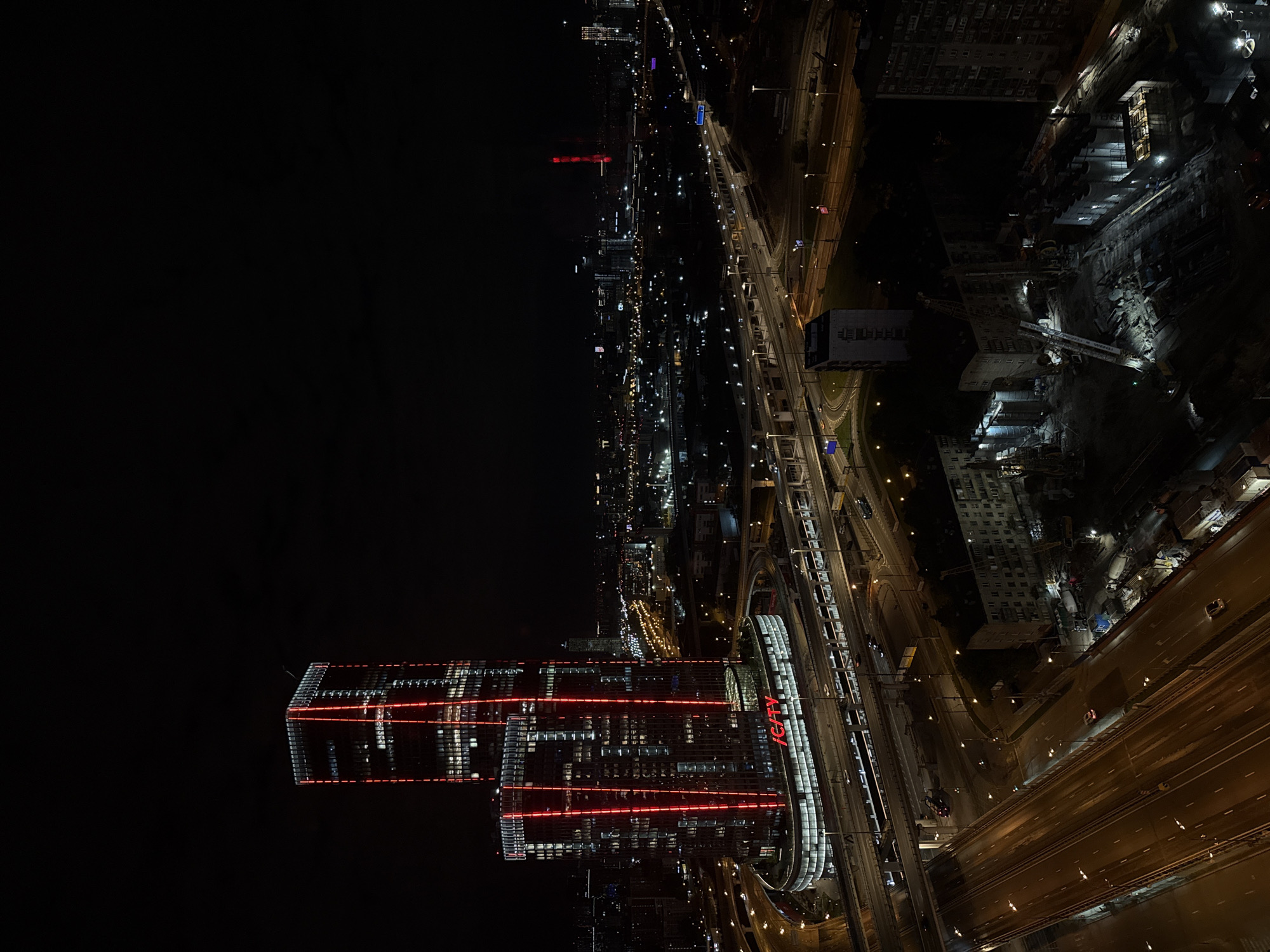 Full moon and illuminated skyscrapers observed in Khimki